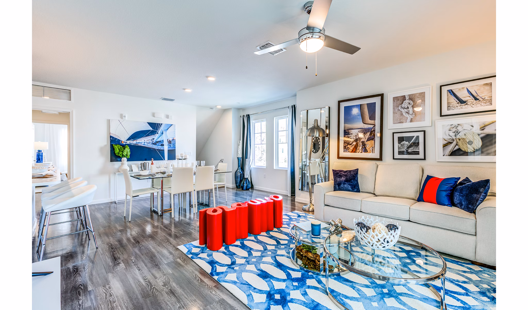 Spacious living room with modern decor and large windows at Pier 8 at The Preserve Apartments