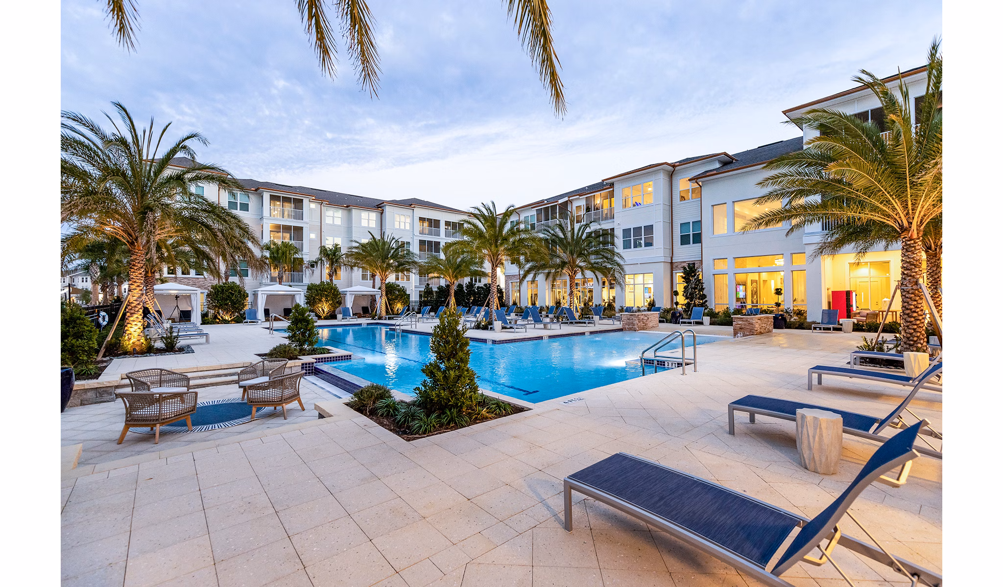 Infinity-edge pool at Pier 8 offers luxury leisure at The Preserve Apartments, surrounded by lush landscaping and modern design
