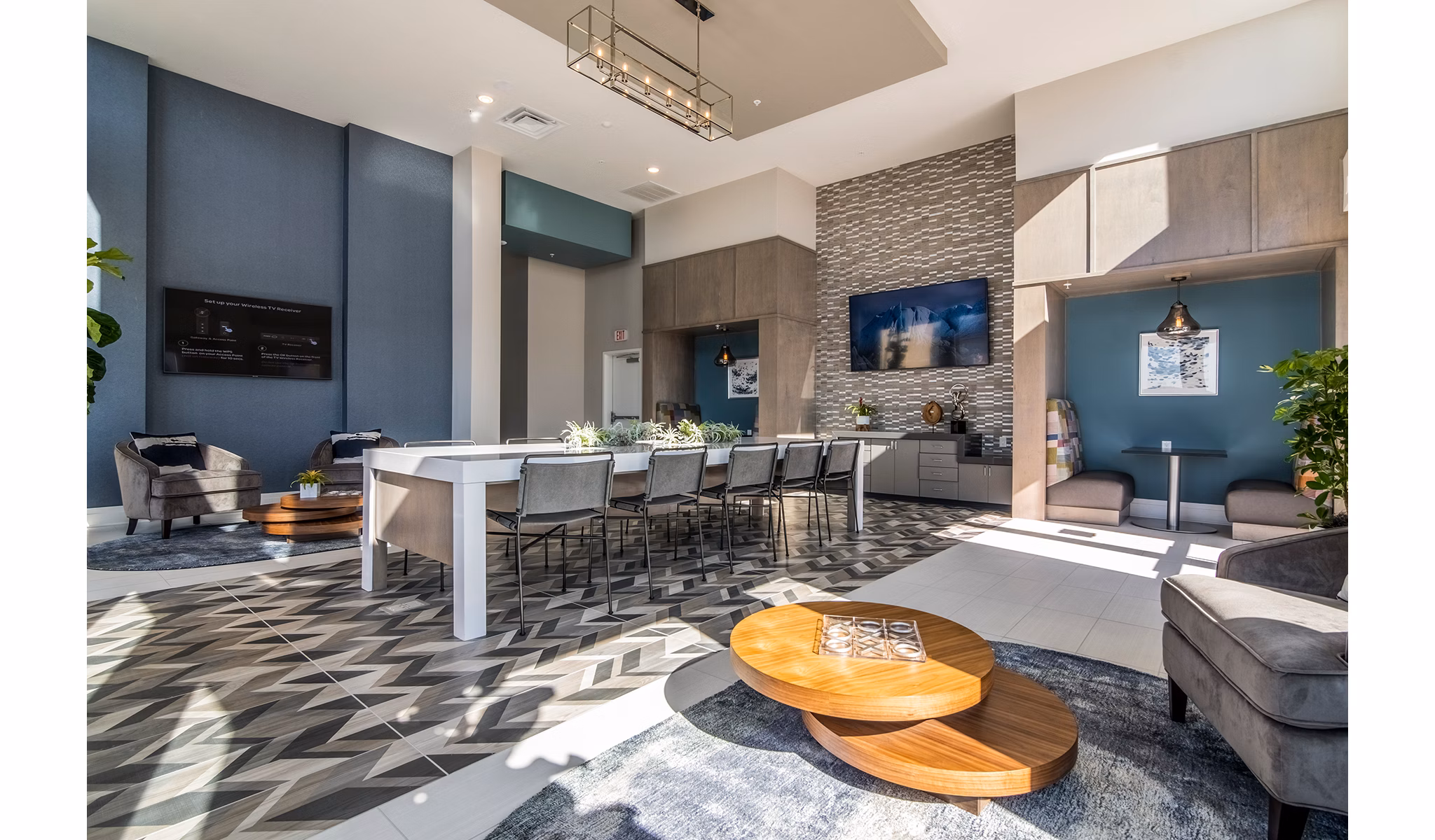 Modern clubhouse lobby with stylish seating and art installations at 10 WestEdge Apartments in Charleston