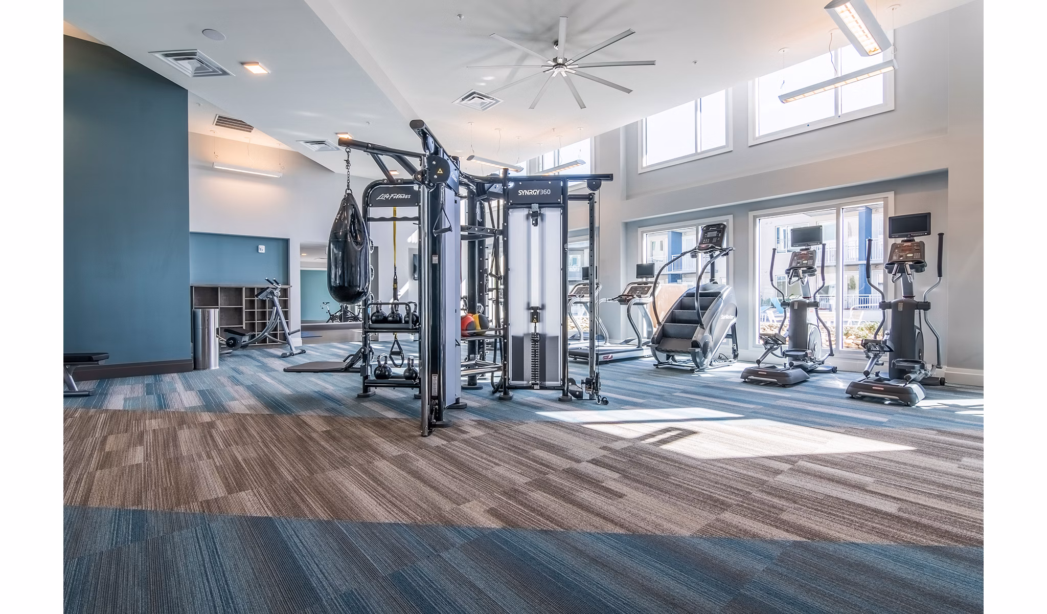 State-of-the-art fitness center at 10 WestEdge Apartments offering modern equipment and workout areas for a luxury living experience