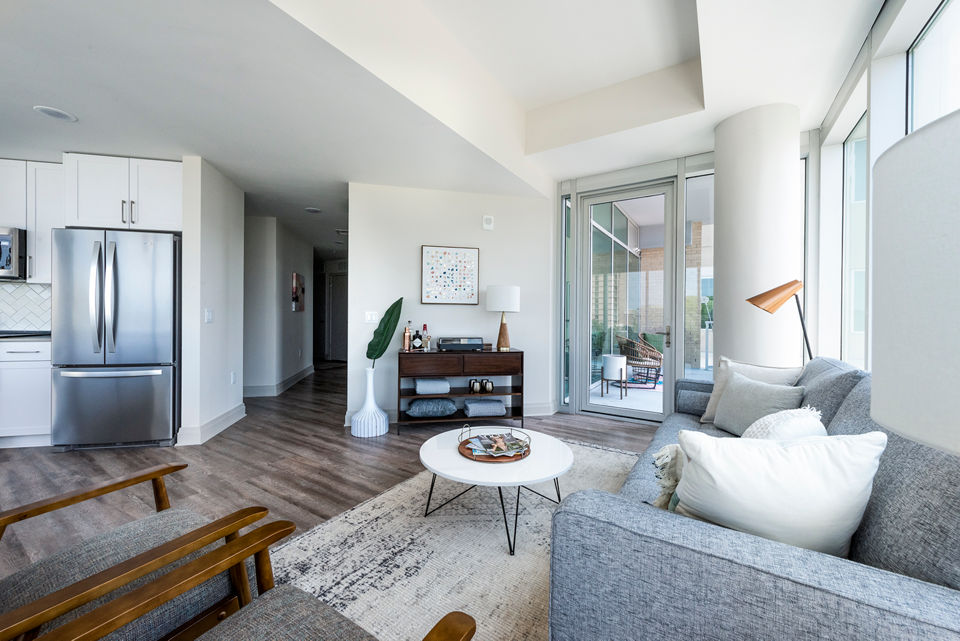 Modern living room with stylish decor and natural light at 10 WestEdge Apartments