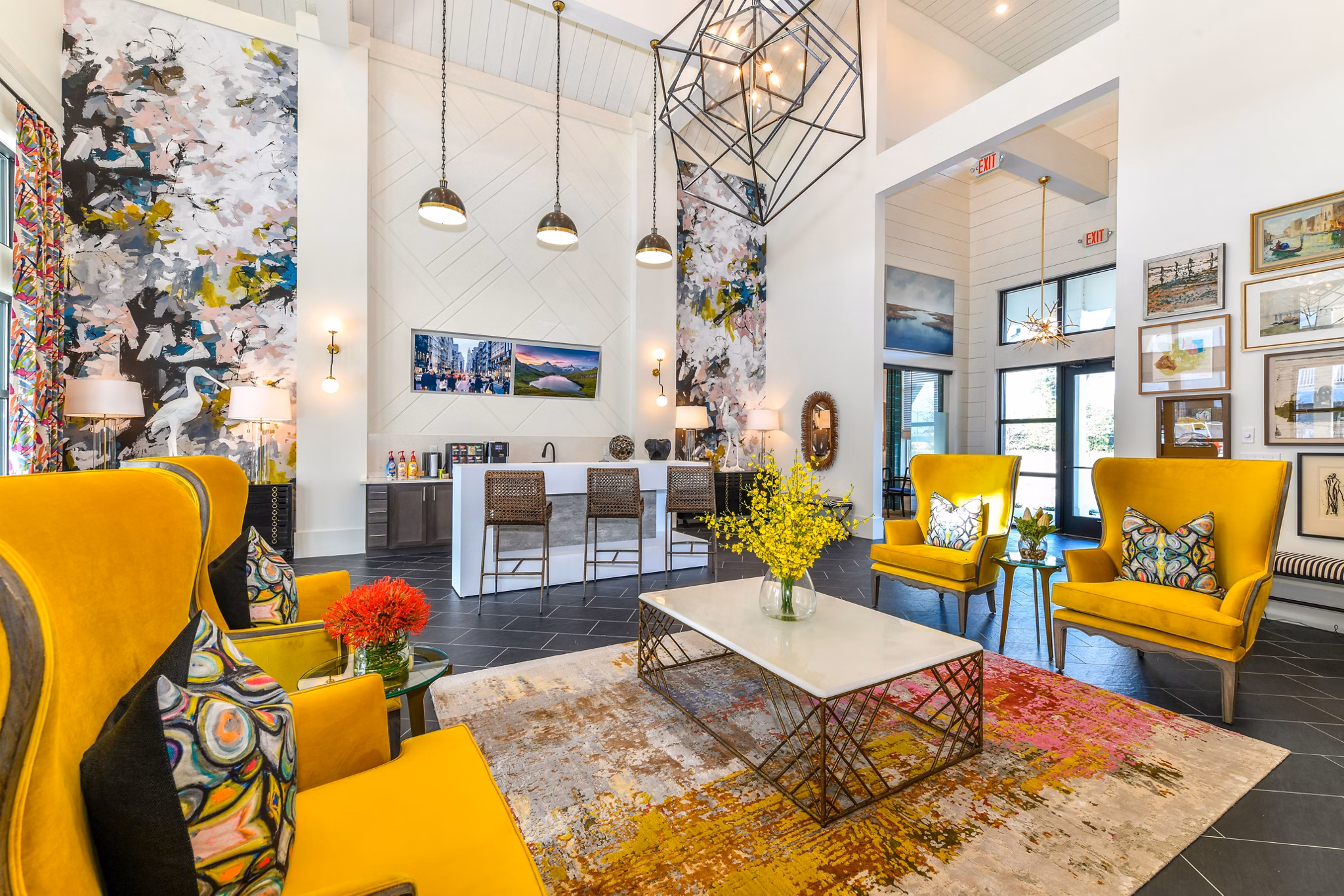Modern clubhouse with sleek seating and entertainment areas at Highland Exchange Apartments in Greystar's luxury community