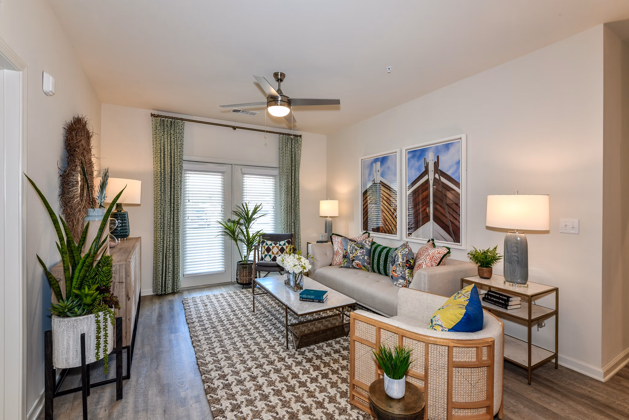 Modern living room with stylish decor and ample natural light at Highland Exchange Apartments
