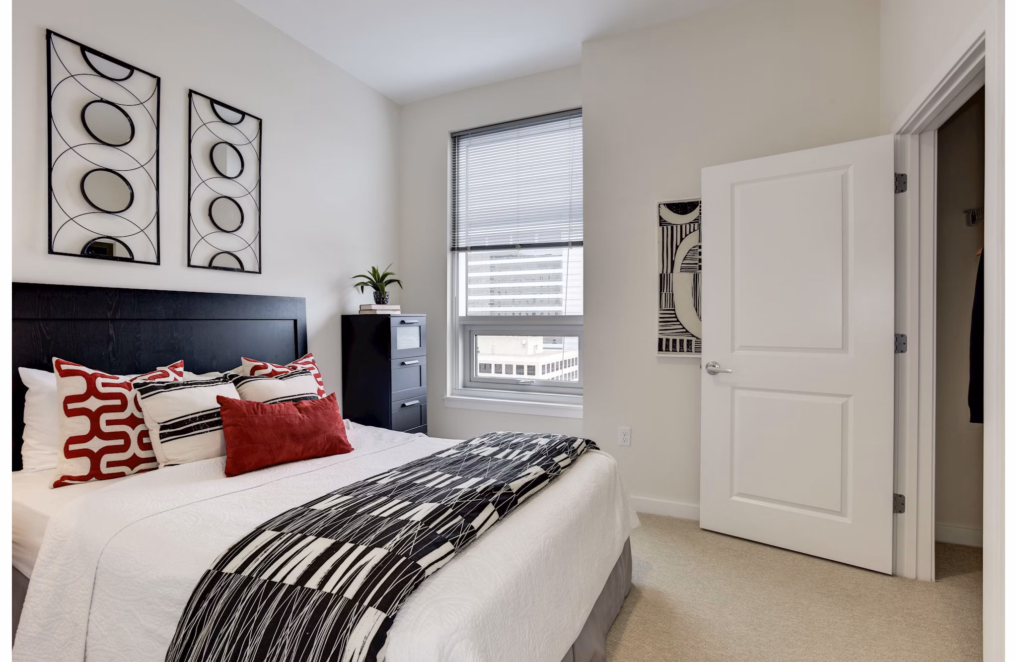 Cozy bedroom with modern decor at 225 N Calvert Apartments