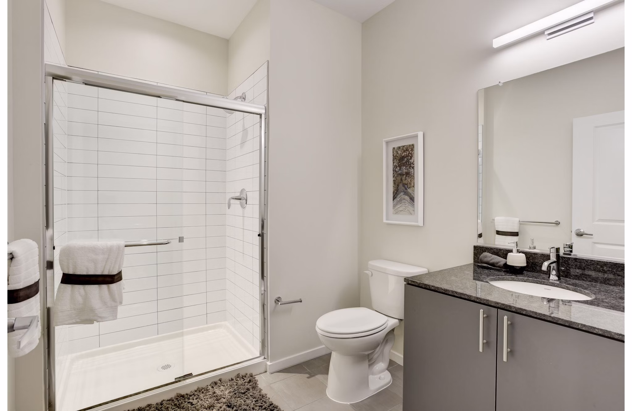 Luxurious bathroom with sleek fixtures at 225 N Calvert Apartments, offering modern design and premium amenities in a prime location