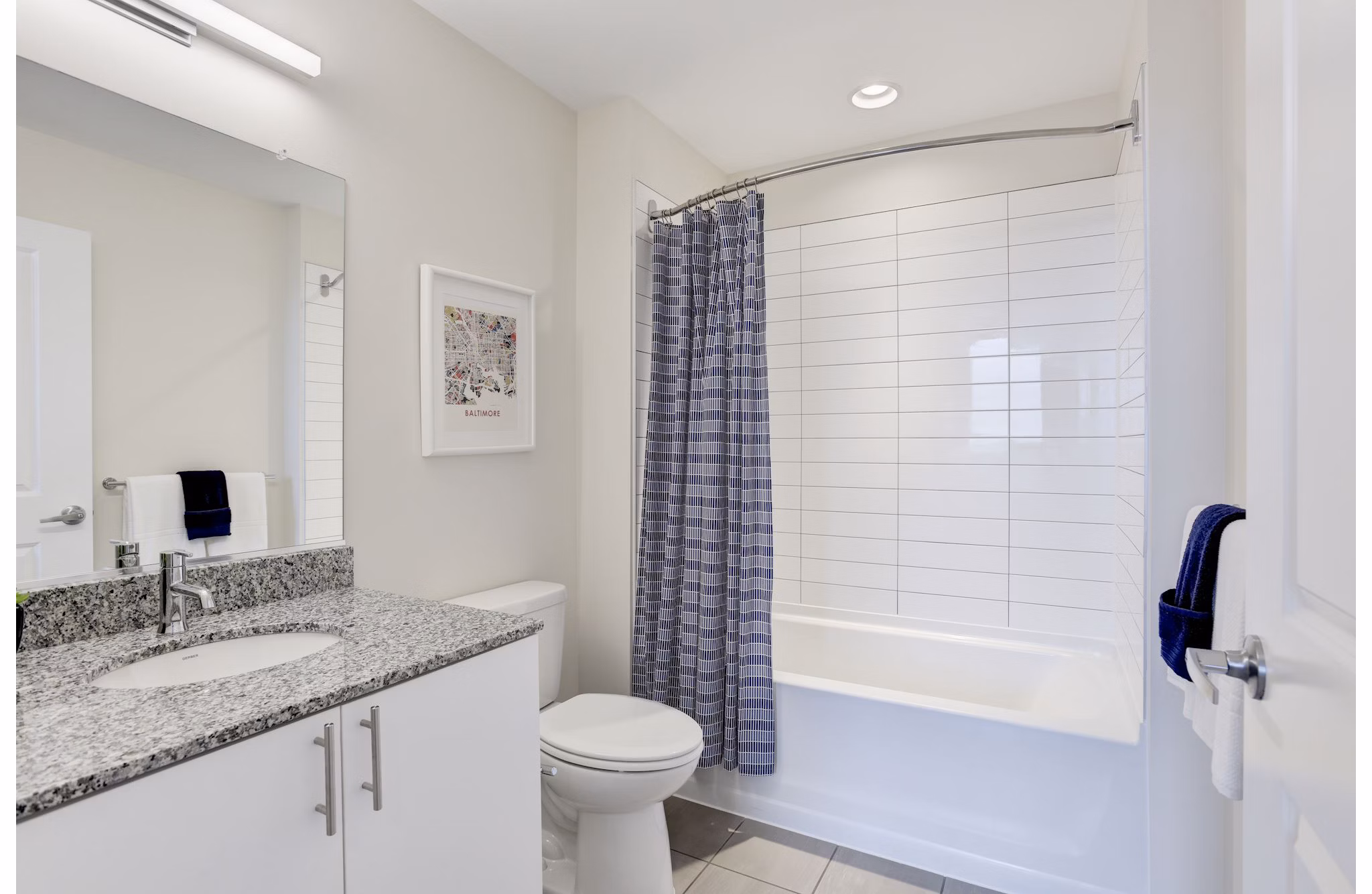 Bathroom featuring modern fixtures and sleek design at 225 N Calvert Apartments