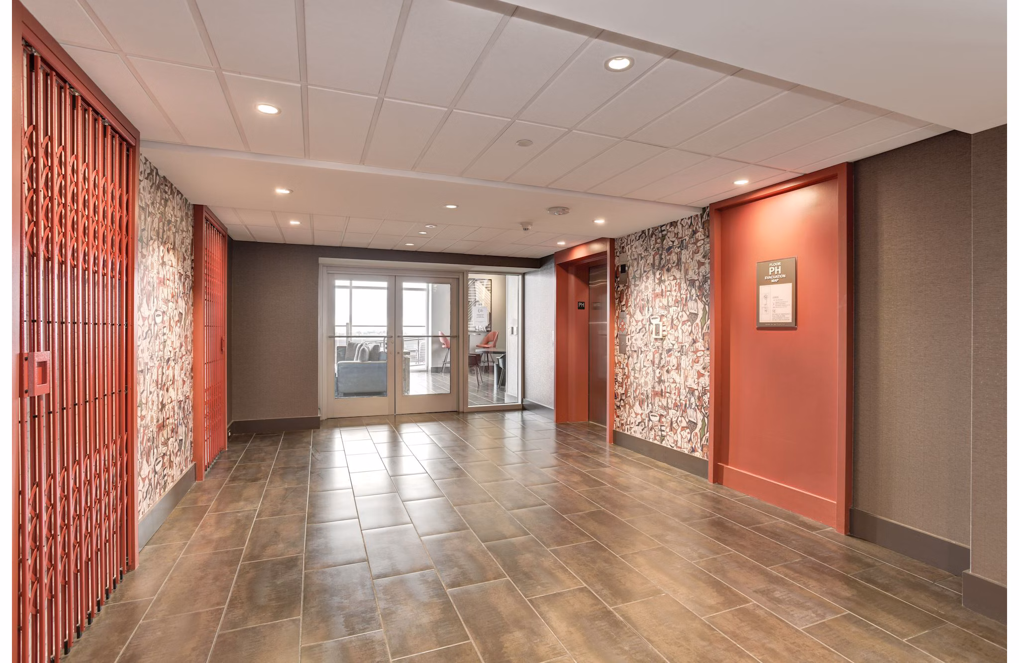 Elegant clubhouse lobby with modern seating and decor at 225 N Calvert Apartments