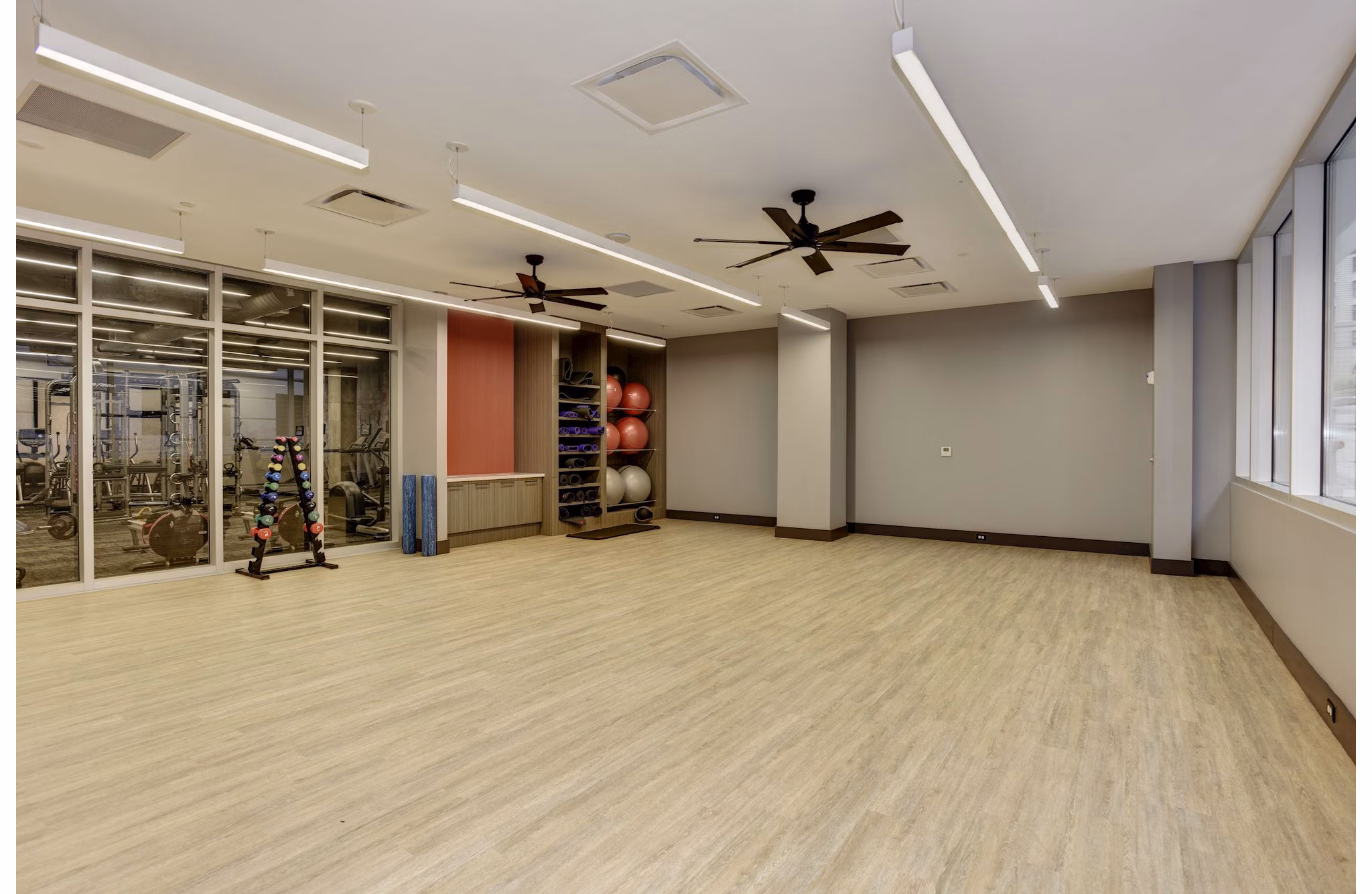 Yoga and spin studio with modern equipment at 225 N Calvert Apartments luxury fitness area