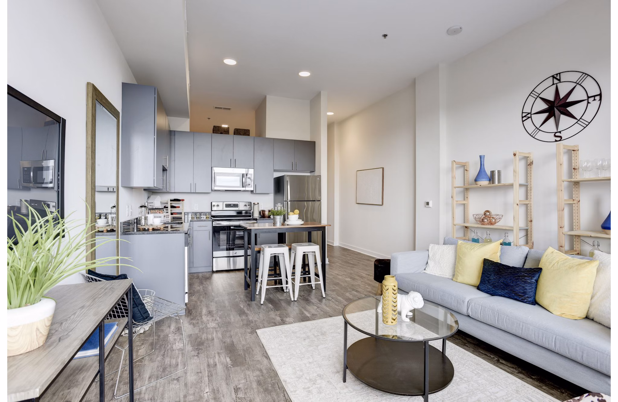 Modern living room with city views at 225 N Calvert Apartments in Baltimore