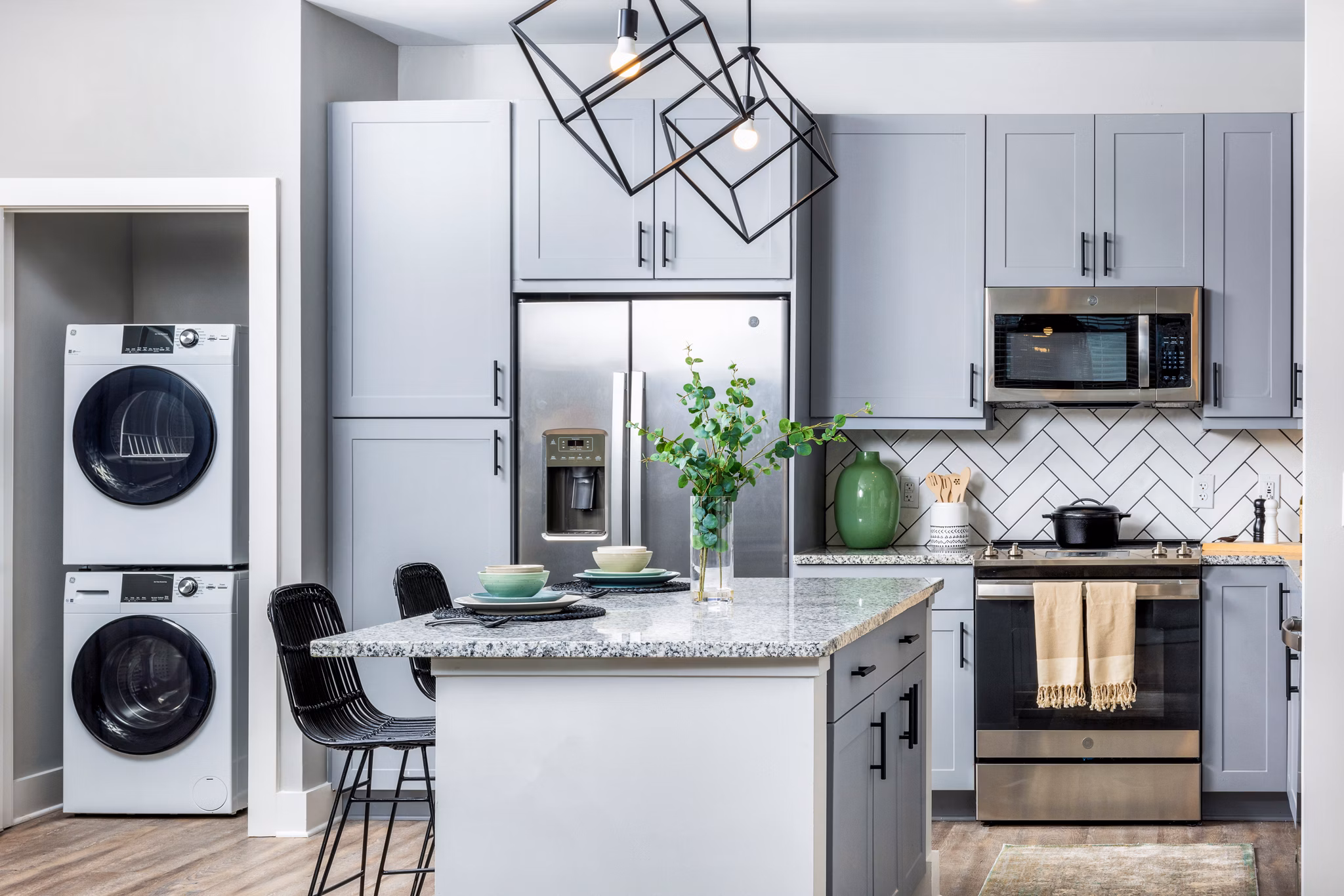 Contemporary kitchen with stainless steel appliances at Broadstone Ingleside Apartments featuring premium finishes