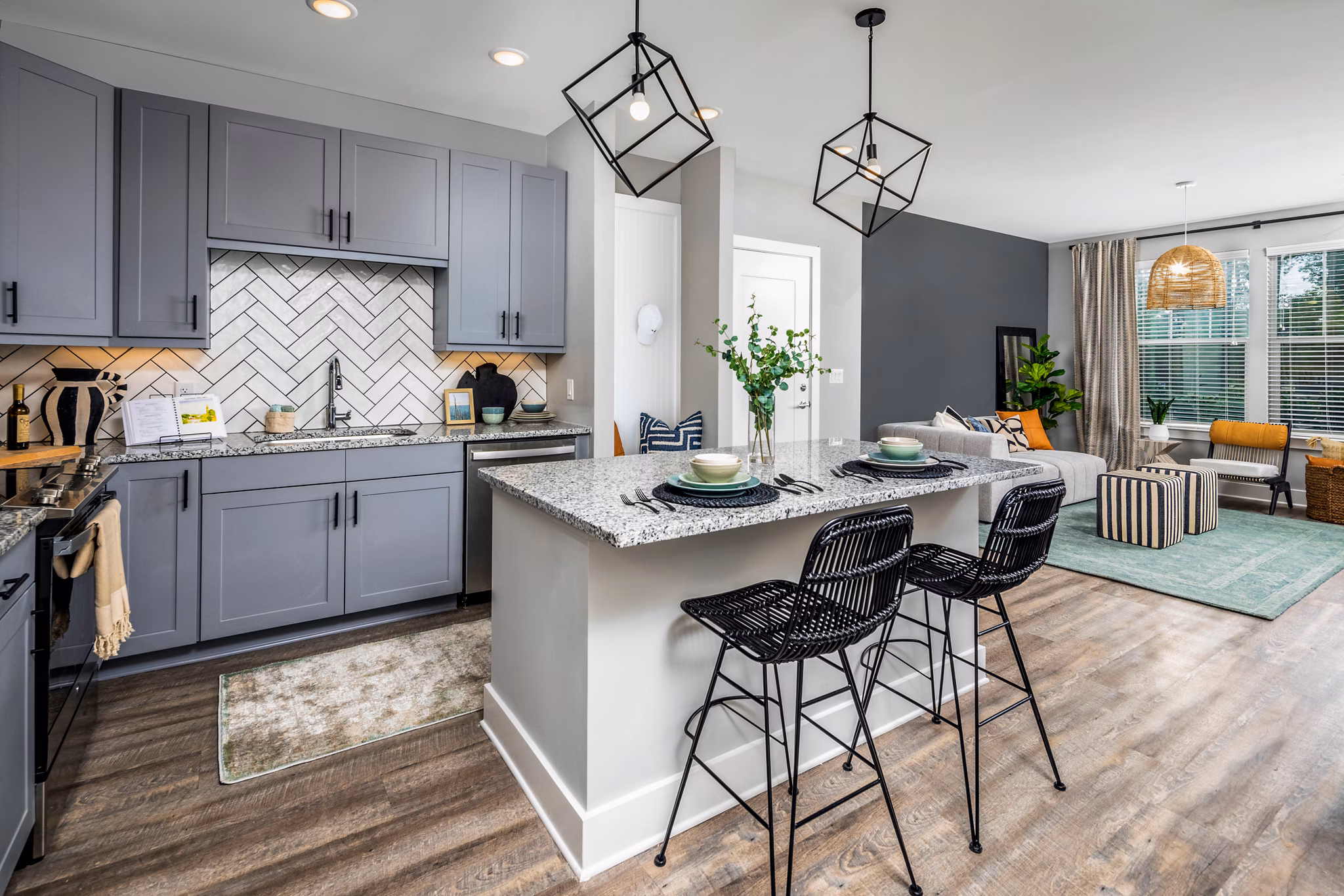 Modern kitchen with sleek appliances and quartz countertops at Broadstone Ingleside Apartments