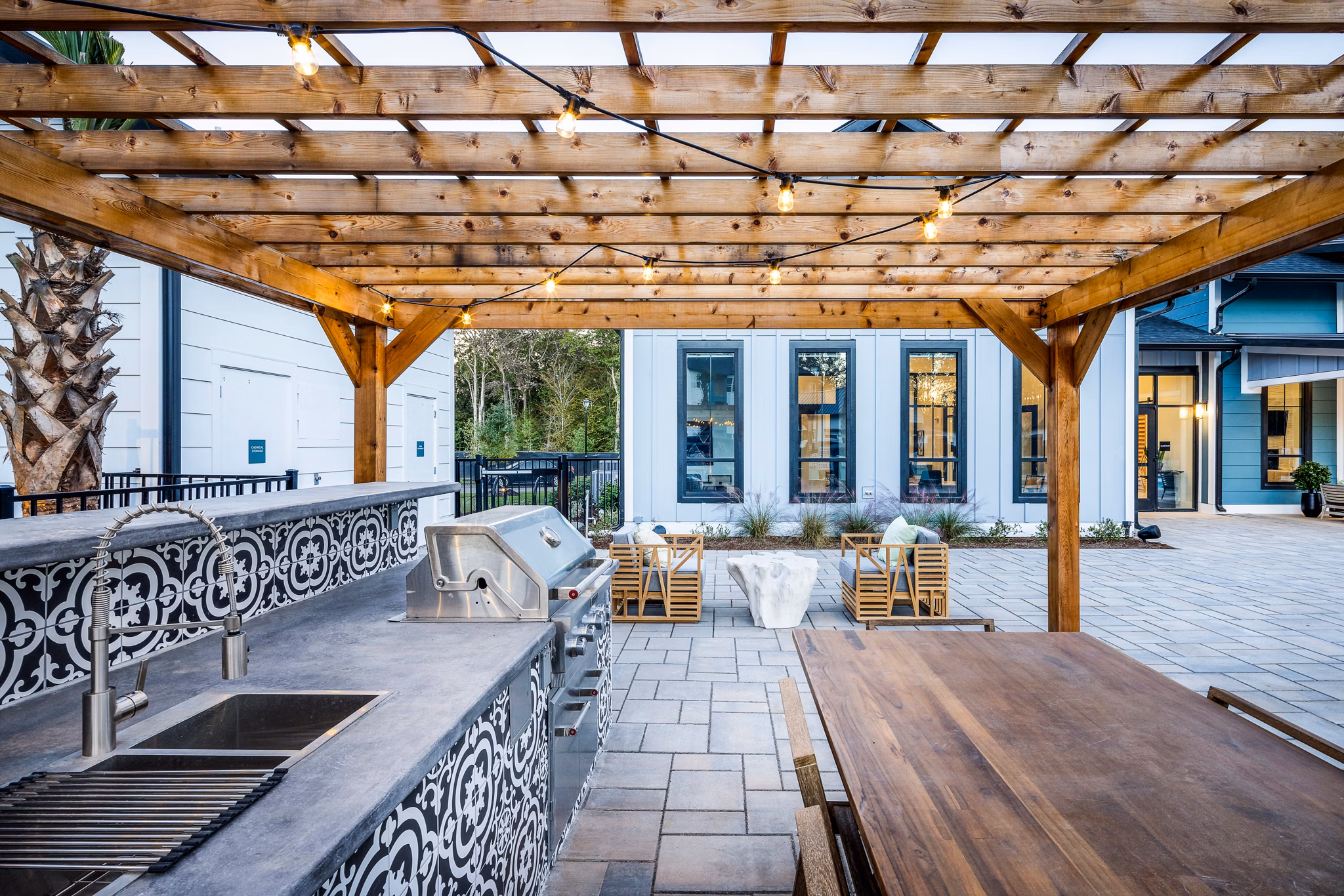 Spacious outdoor grill area with modern seating at Broadstone Ingleside Apartments, ideal for social gatherings and barbecues