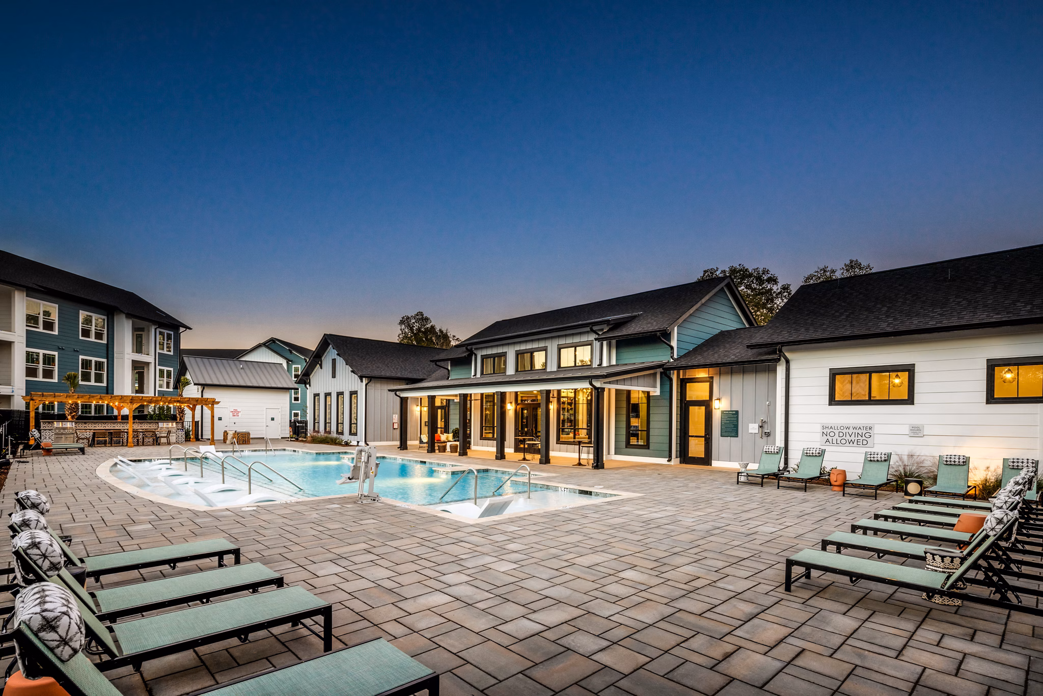 Luxury outdoor pool at Broadstone Ingleside Apartments, featuring lounge seating and lush landscaping in Charleston
