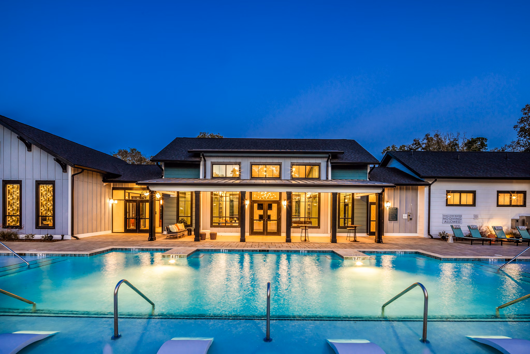 Resort-style pool with lounge seating at Broadstone Ingleside Apartments, luxury living in a vibrant community