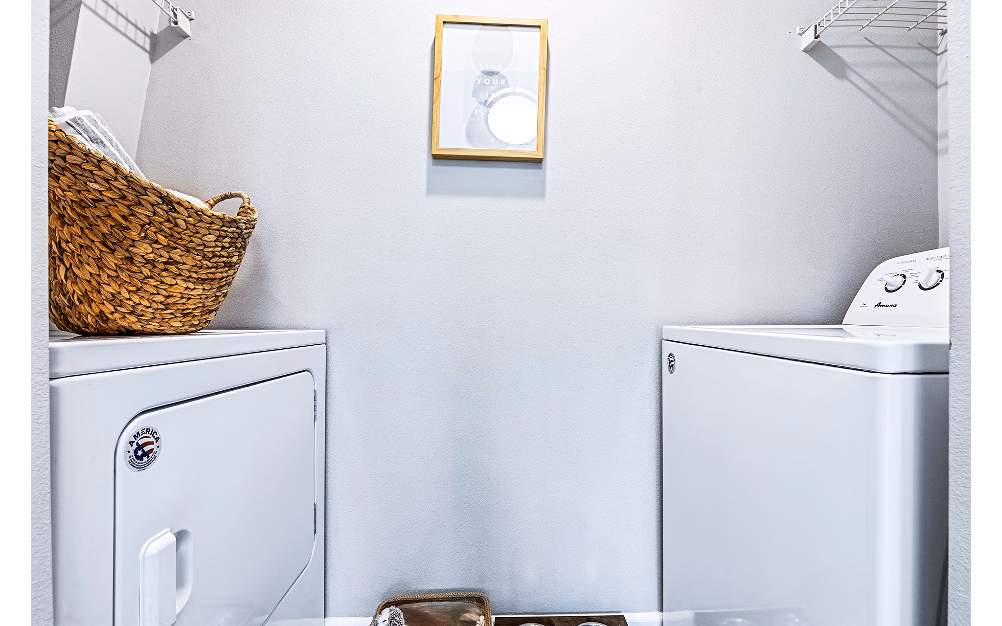 Modern laundry room with front-loading washers and dryers in Vista Commons Apartments, offering convenience and style for residents