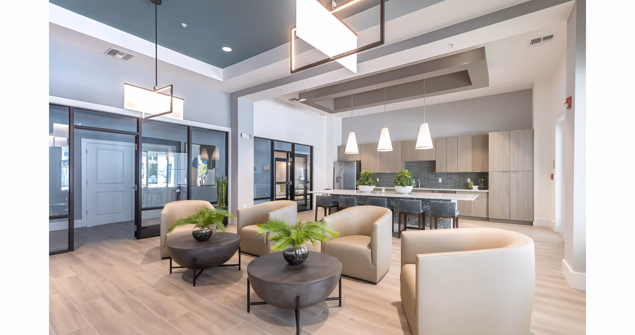 Clubhouse at Calirosa Apartments: Modern entertaining space with cozy seating areas and billiards table at luxury Calirosa Apartments