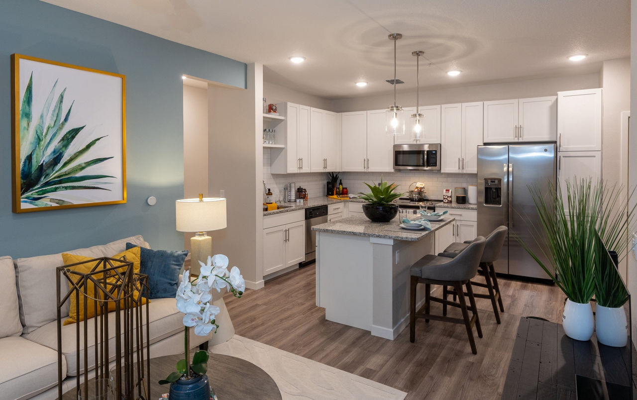 Spacious living room with modern furnishings at Calirosa Apartments in San Diego, reflecting luxury and comfort suitable for upscale living