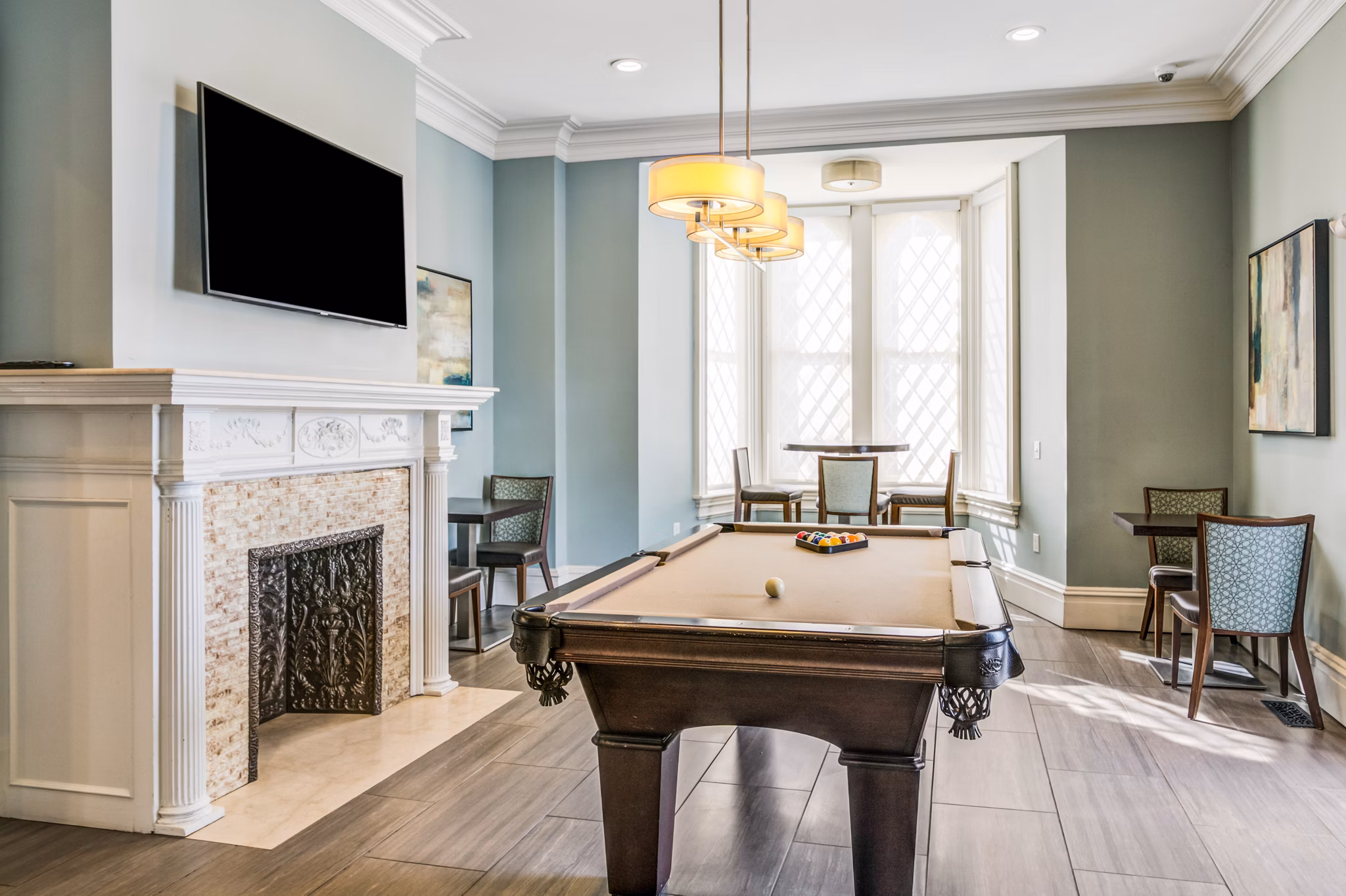 Game room with pool tables and arcade games at Terraces on the Hudson Apartments