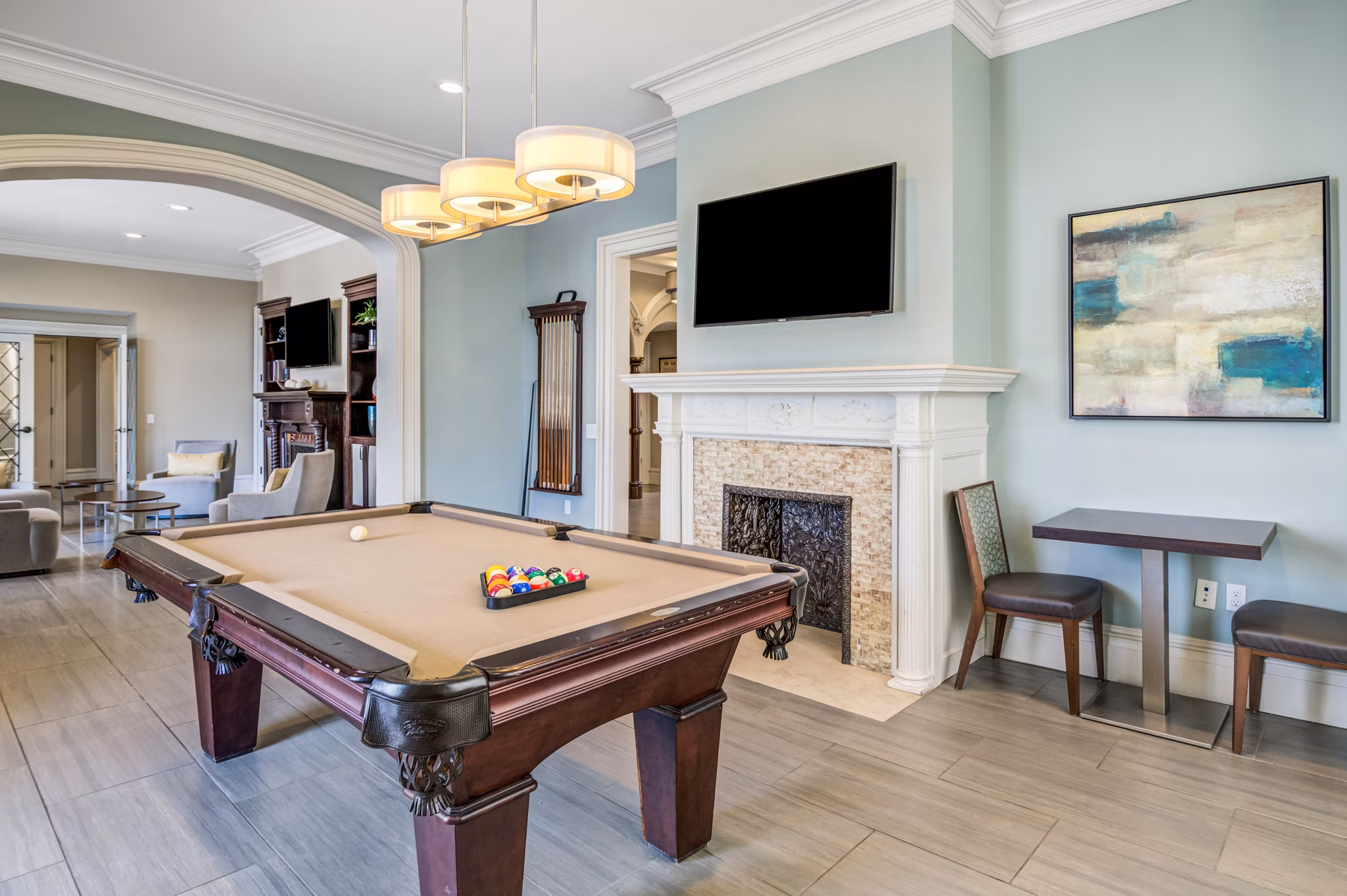 Game room with modern decor and pool table at Terraces on the Hudson Apartments