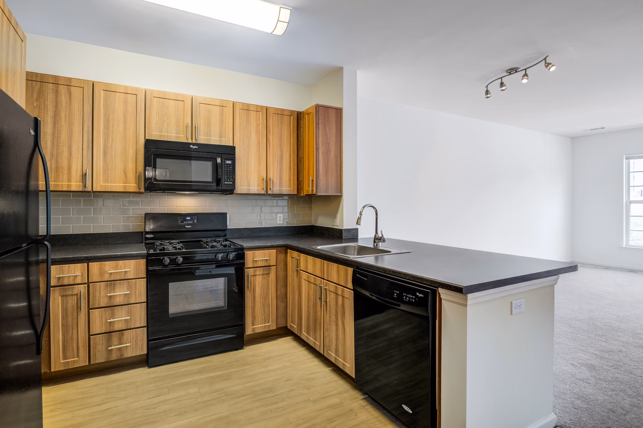 Modern kitchen with stainless steel appliances at Terraces on the Hudson Apartments, luxury living space near the Hudson River