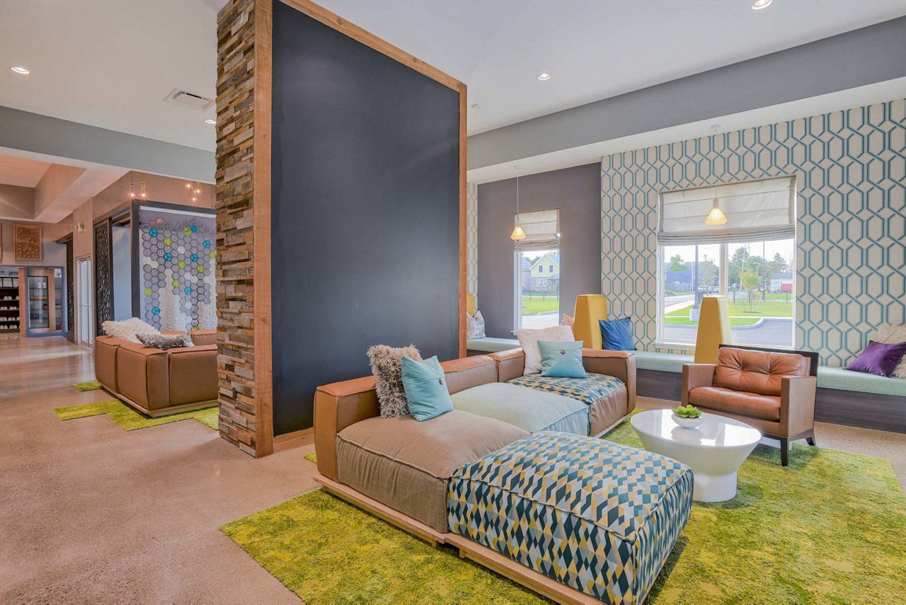 Clubhouse featuring modern design and flexible seating at 101 Center Apartments
