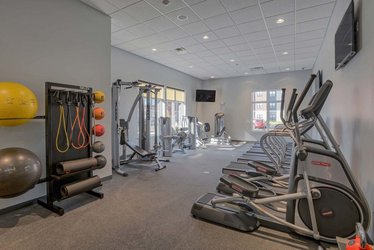 Monarch 716 Apartments: State-of-the-art fitness center with modern equipment for residents