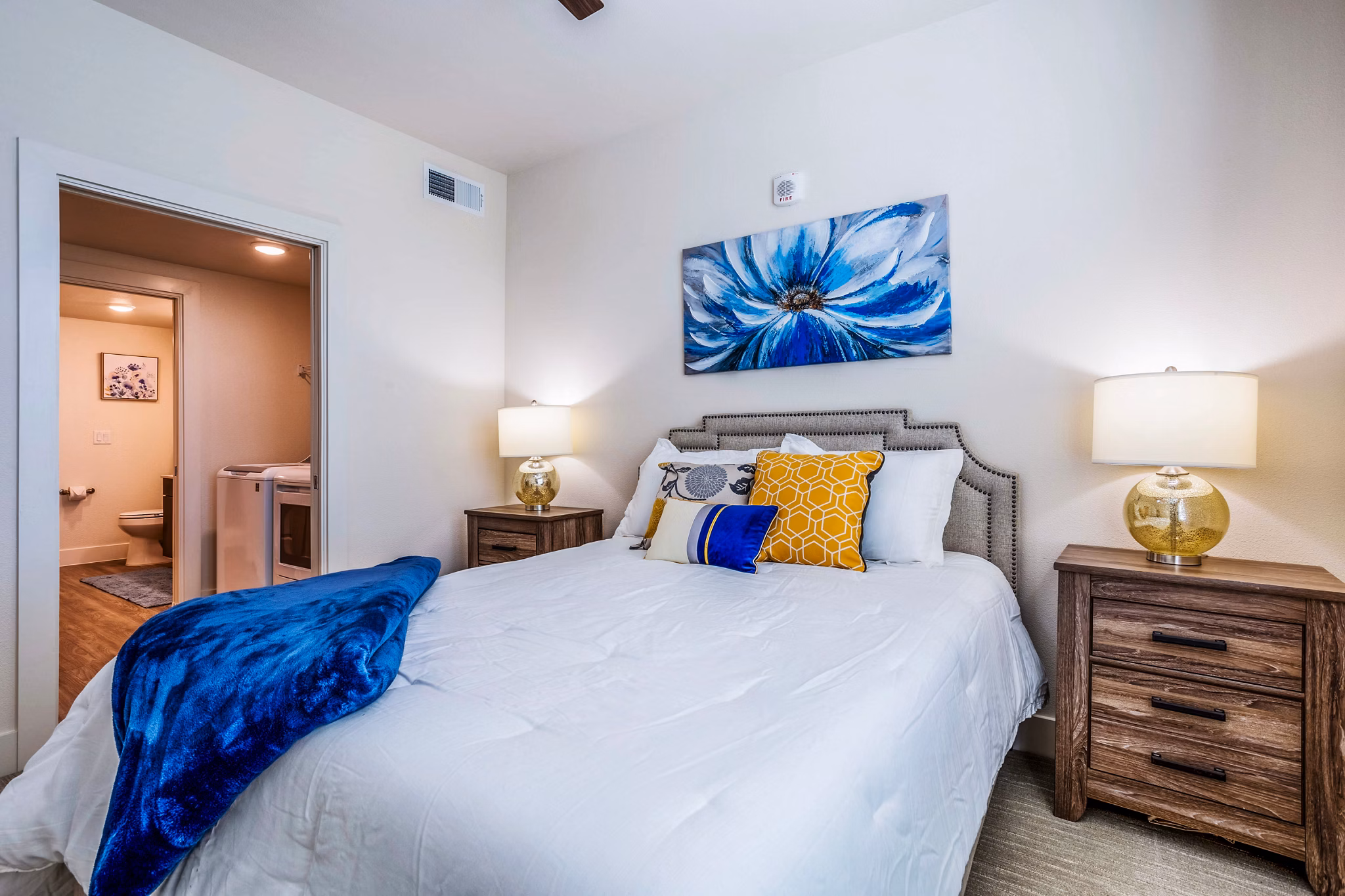 Bedroom featuring elegant design and cozy ambiance at Larkspur at Shadow Creek Apartments