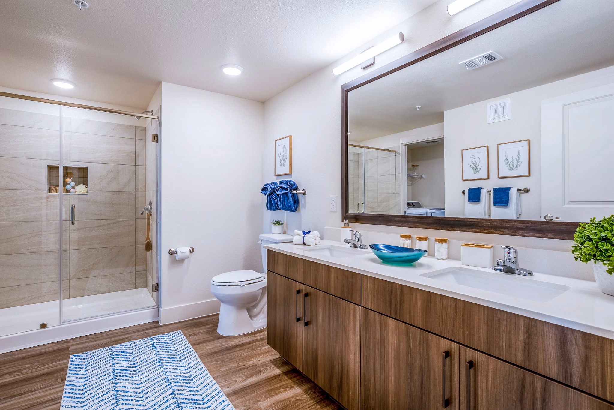 Bathroom with elegant vanity and soaking tub in Larkspur at Shadow Creek Apartments