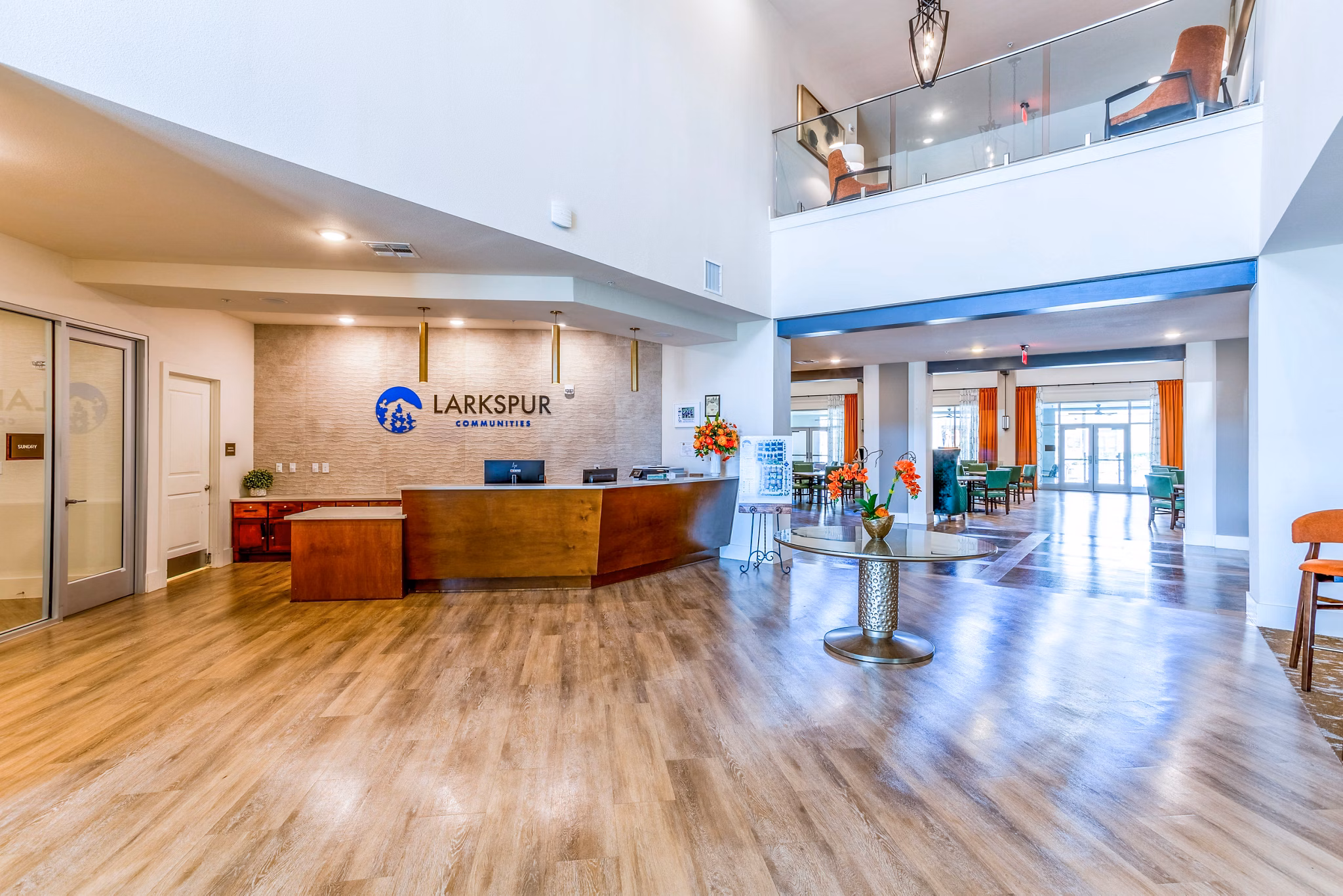 Clubhouse featuring modern design and cozy seating at Larkspur at Shadow Creek Apartments, an elegant community space for residents