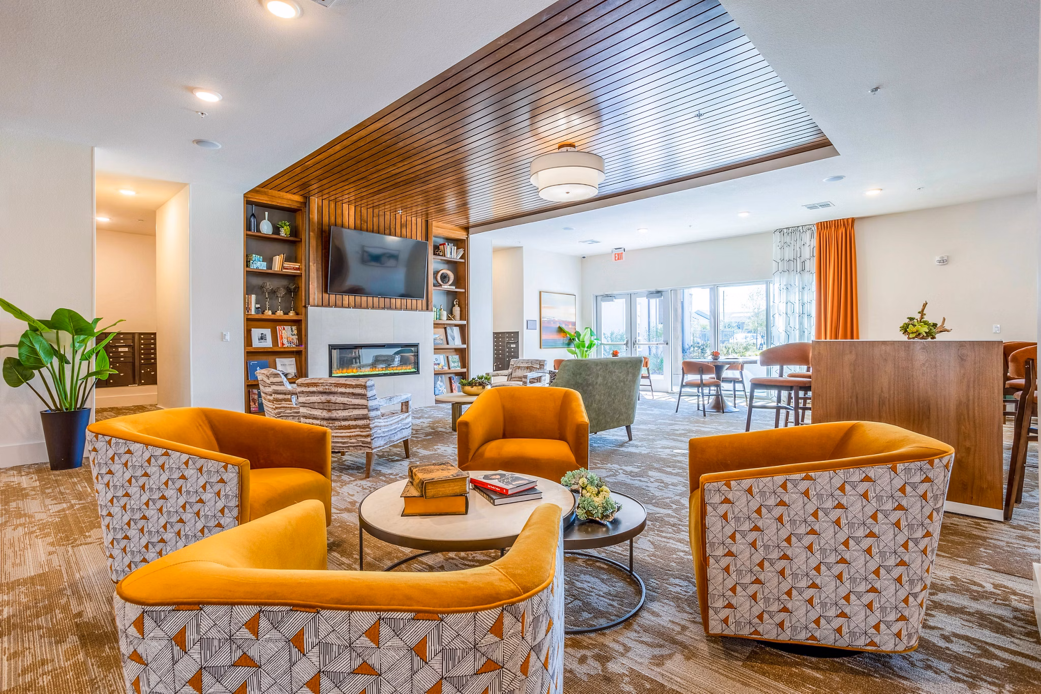 Modern clubhouse with stylish lounge seating at Larkspur at Shadow Creek Apartments, offering luxurious amenities in a welcoming community