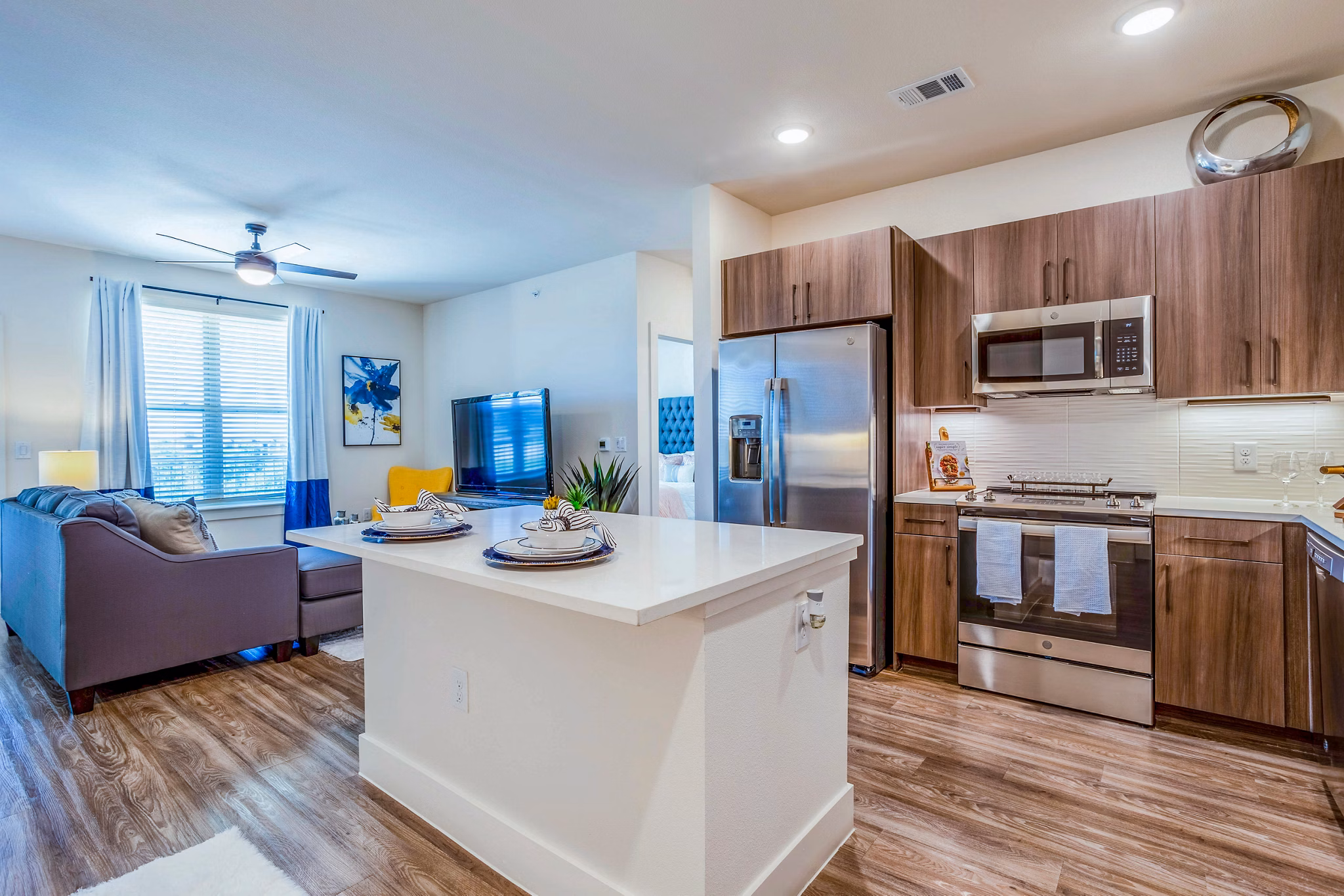 Modern kitchen with stainless steel appliances at Larkspur at Shadow Creek Apartments in a luxury setting