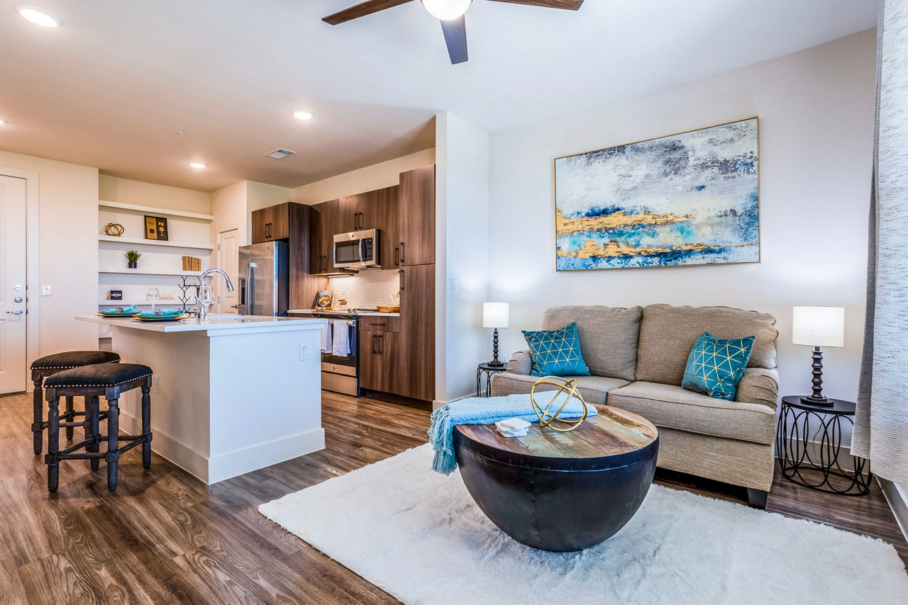 Modern living room with stylish furniture and natural light at Larkspur at Shadow Creek Apartments