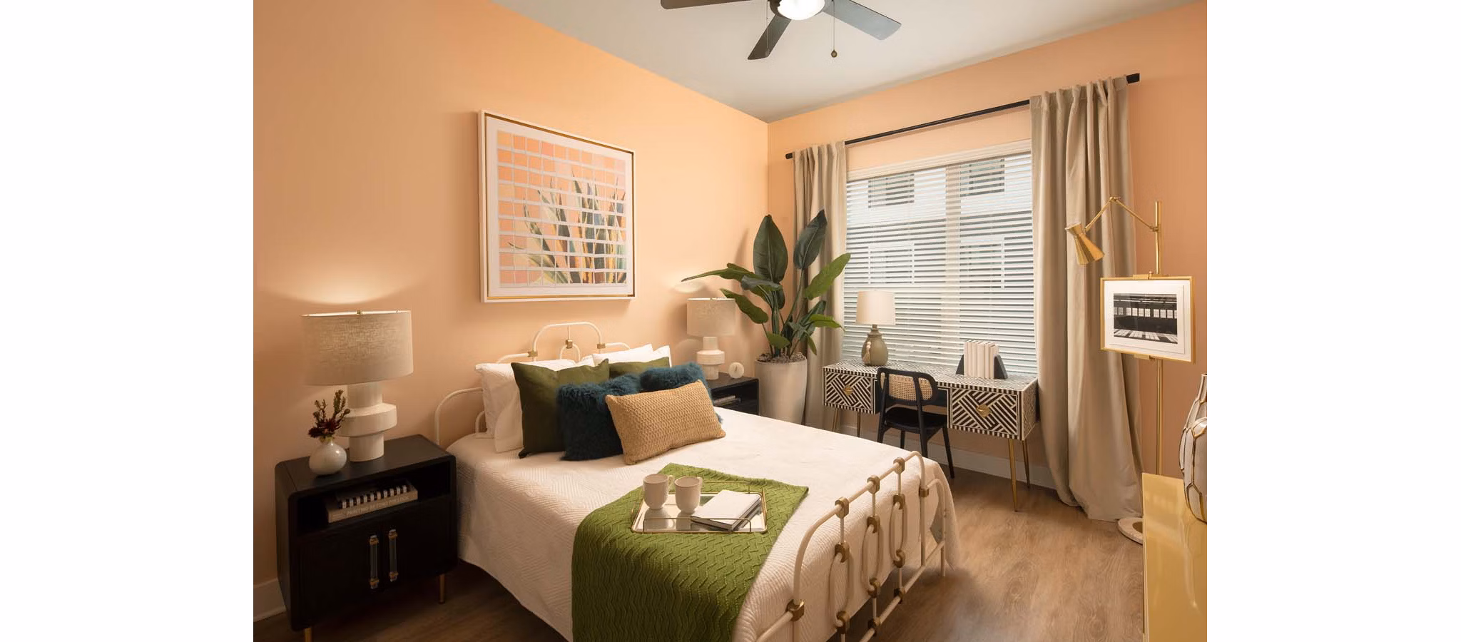 Bedroom featuring modern decor and a large window at Novel Midtown Tampa Apartments