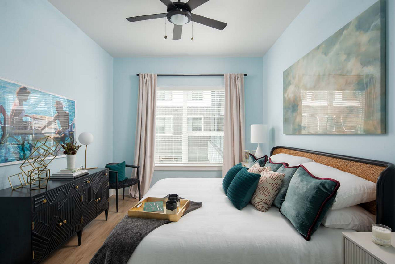 Cozy bedroom with modern furnishings at Novel Midtown Tampa Apartments
