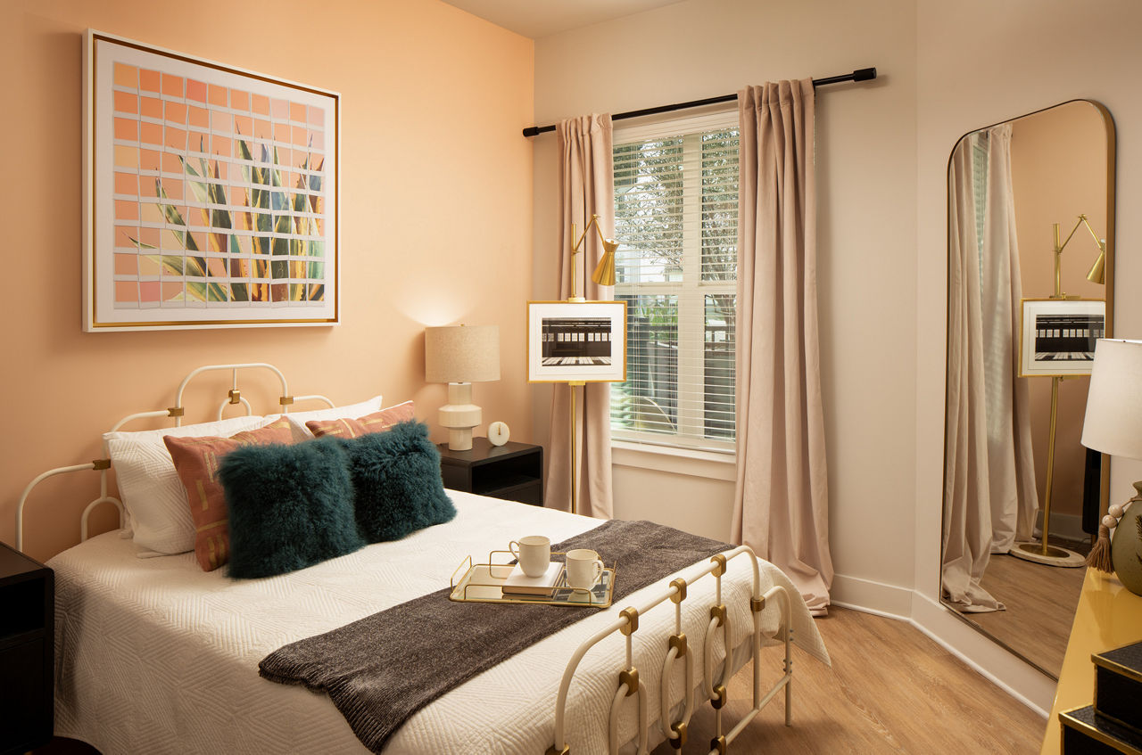 Bedroom with elegant design and modern furnishings at Novel Midtown Tampa Apartments
