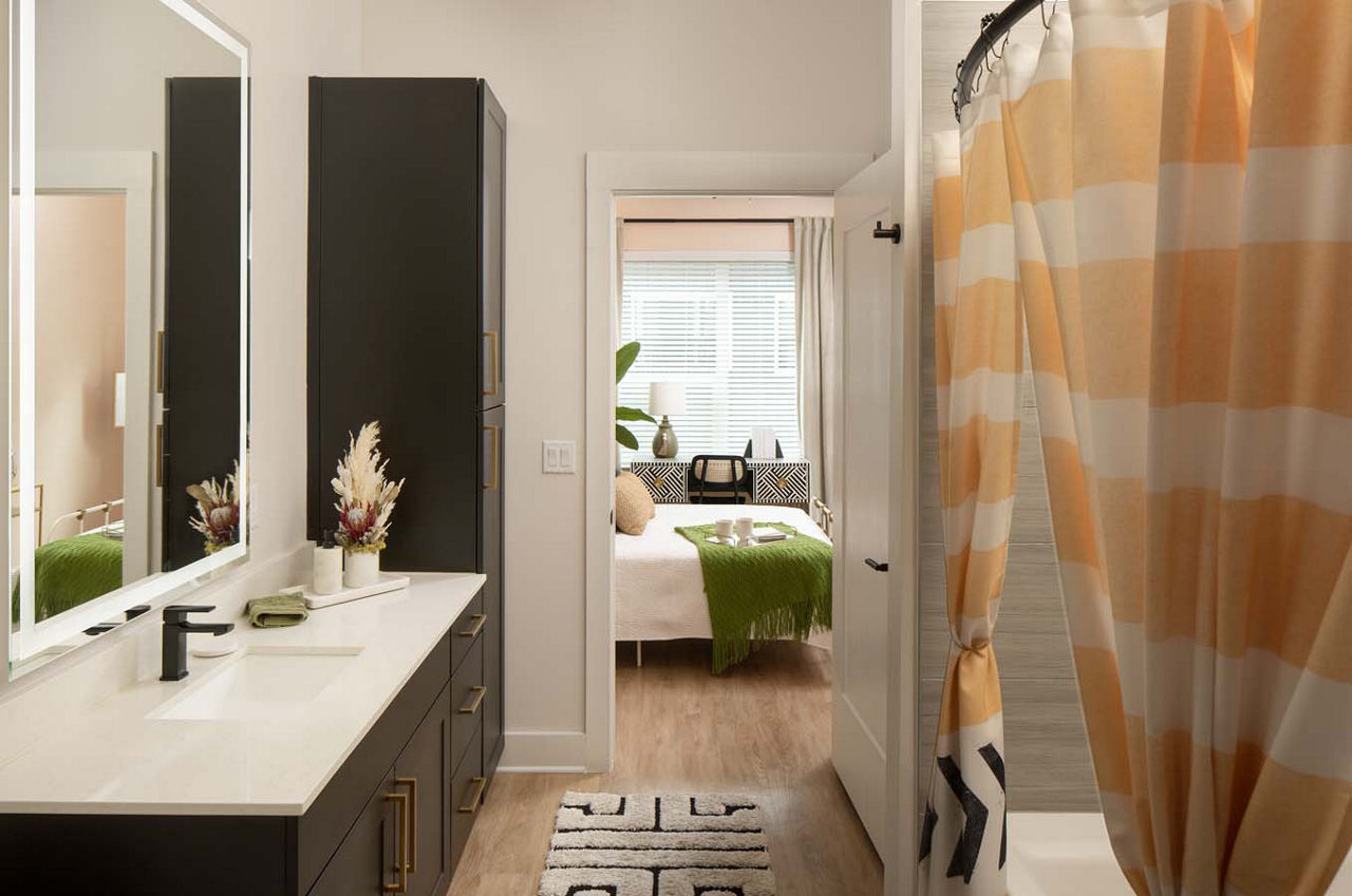 Bathroom with marble countertops and modern fixtures at Novel Midtown Tampa Apartments