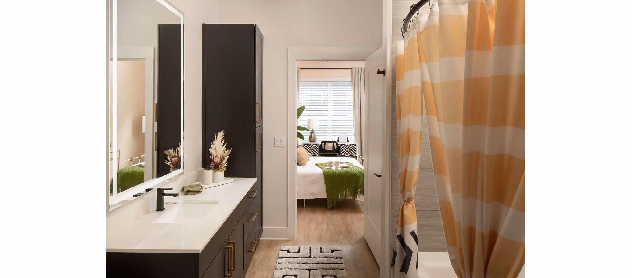 Bathroom with marble countertops and modern fixtures at Novel Midtown Tampa Apartments