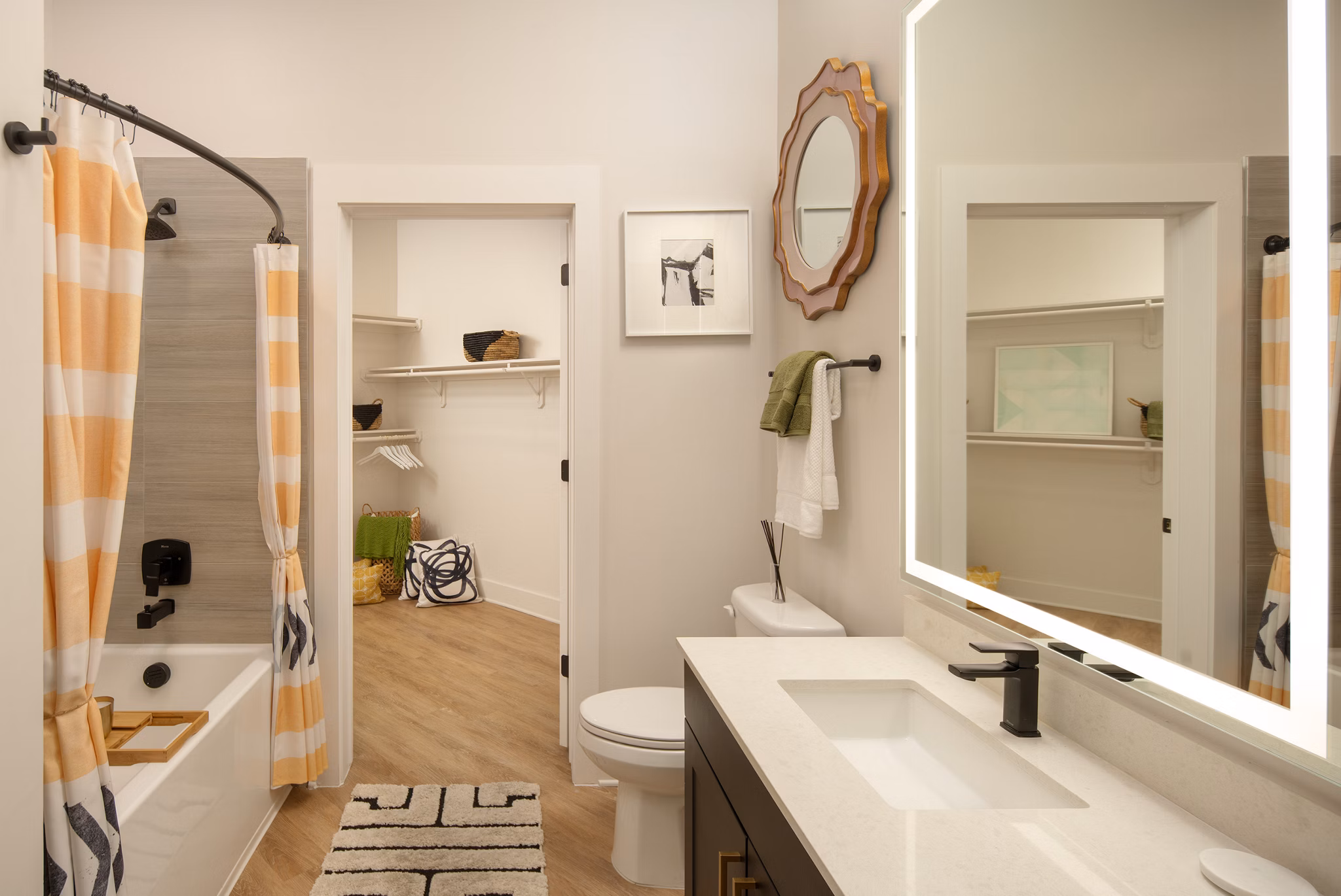 Bathroom featuring modern fixtures and marble countertops at Novel Midtown Tampa Apartments, a luxurious property by Greystar