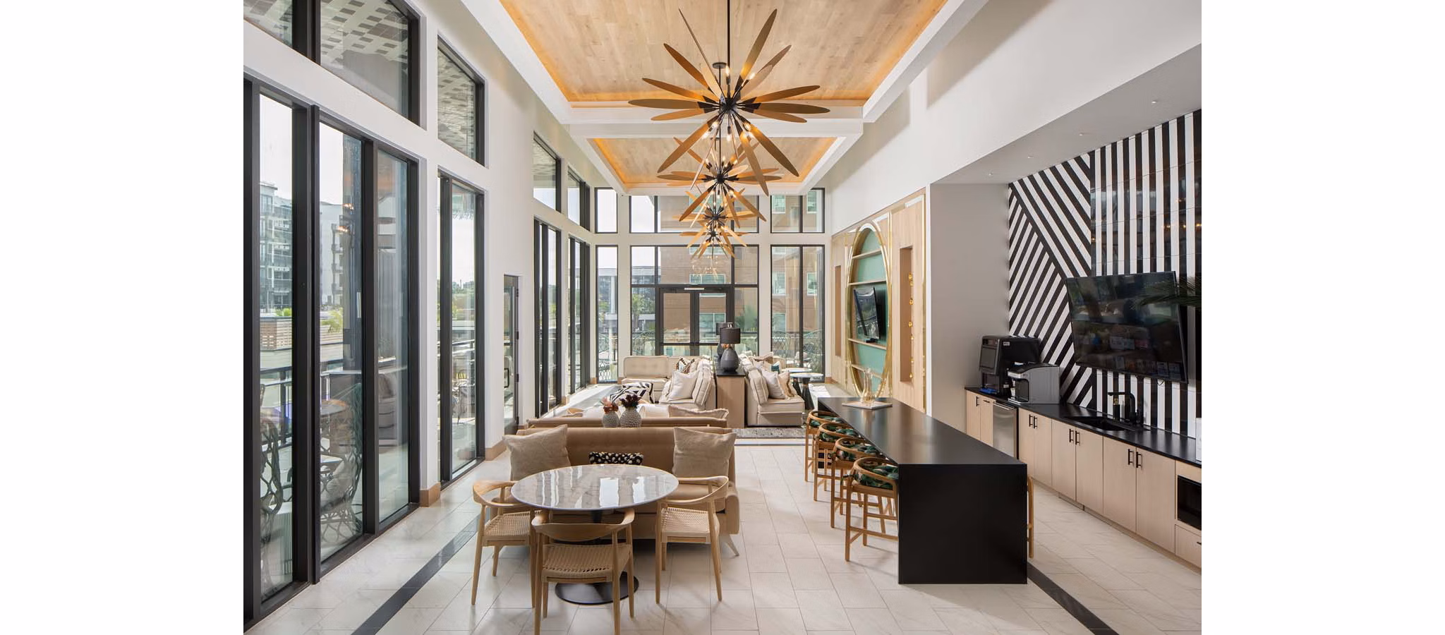 Modern clubhouse with stylish seating and pool table at Novel Midtown Tampa Apartments