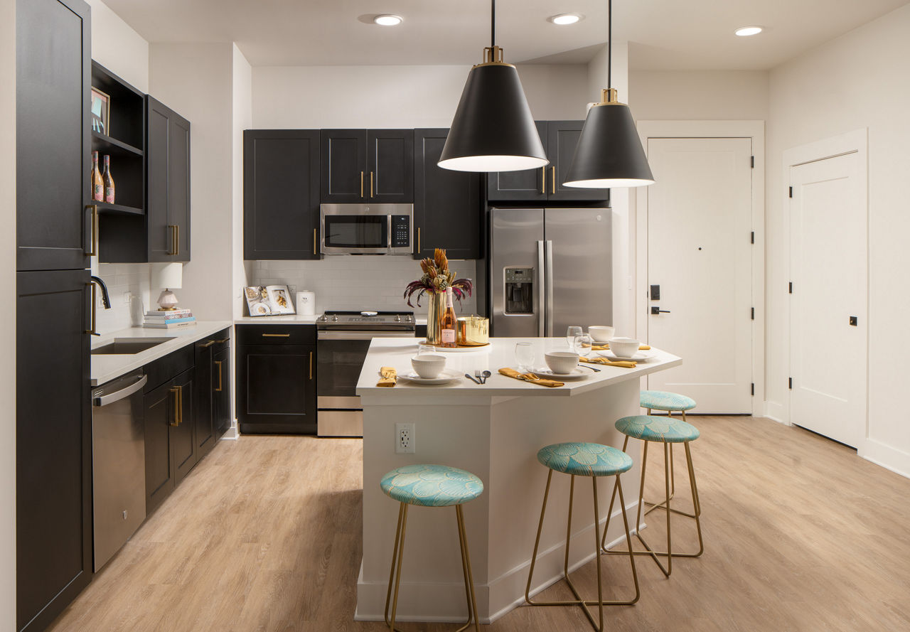 Modern kitchen with sleek cabinetry and stainless steel appliances at Novel Midtown Tampa Apartments
