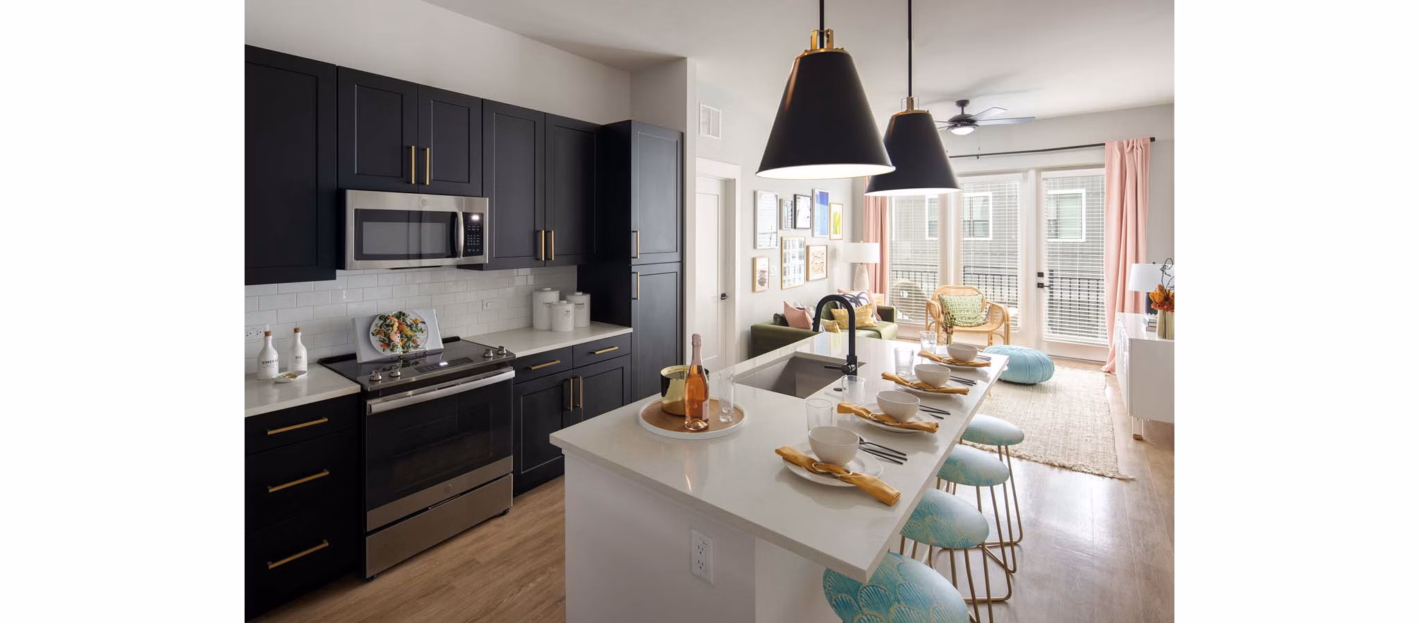Kitchen with stainless steel appliances and granite countertops at Novel Midtown Tampa Apartments