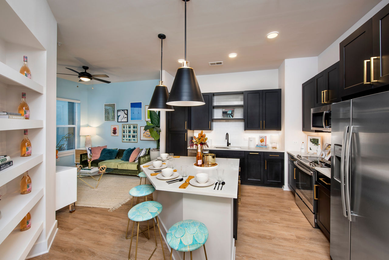 Kitchen with modern appliances and sleek countertops in Novel Midtown Tampa Apartments