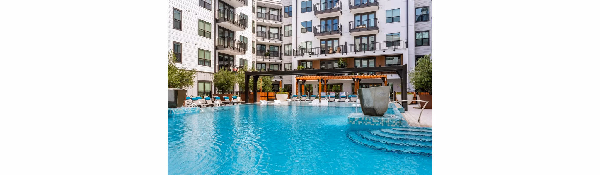 Rooftop pool with skyline views at Novel Midtown Tampa Apartments