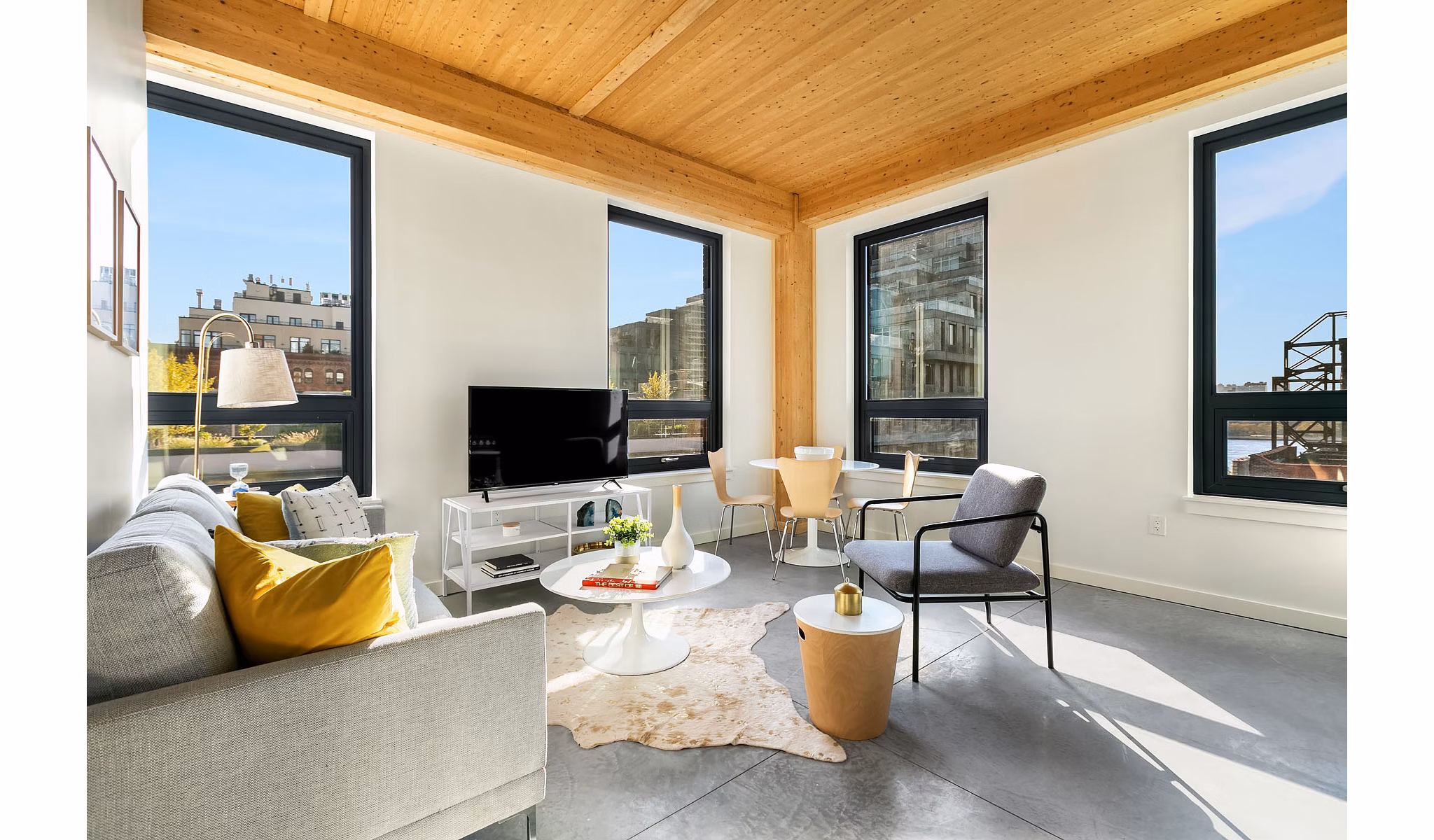 Spacious living room with modern decor in 360 Wythe Apartments, luxury residences in a prime neighborhood