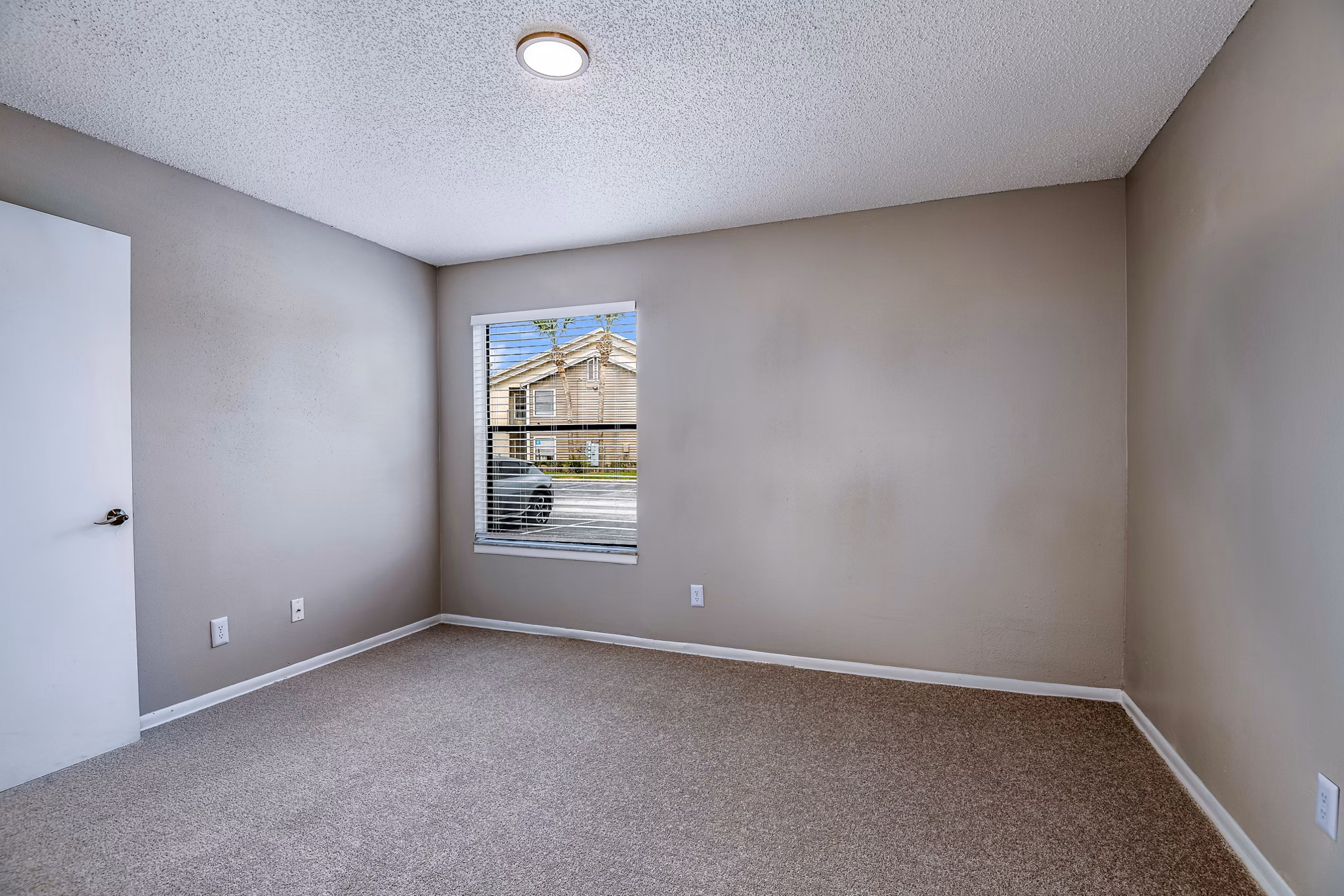 Inviting bedroom with cozy decor at Heron Lake Apartments, showcasing comfortable living spaces in luxury settings