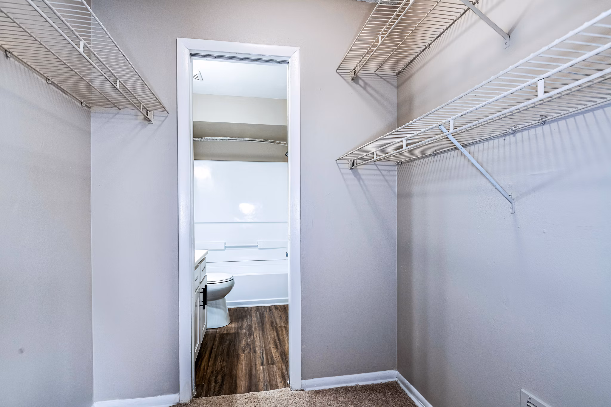 Bedroom closet with ample storage space at Heron Lake Apartments