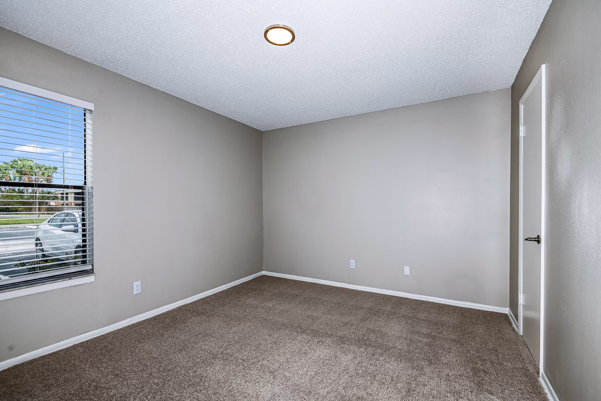 Cozy bedroom with stylish decor at Heron Lake Apartments