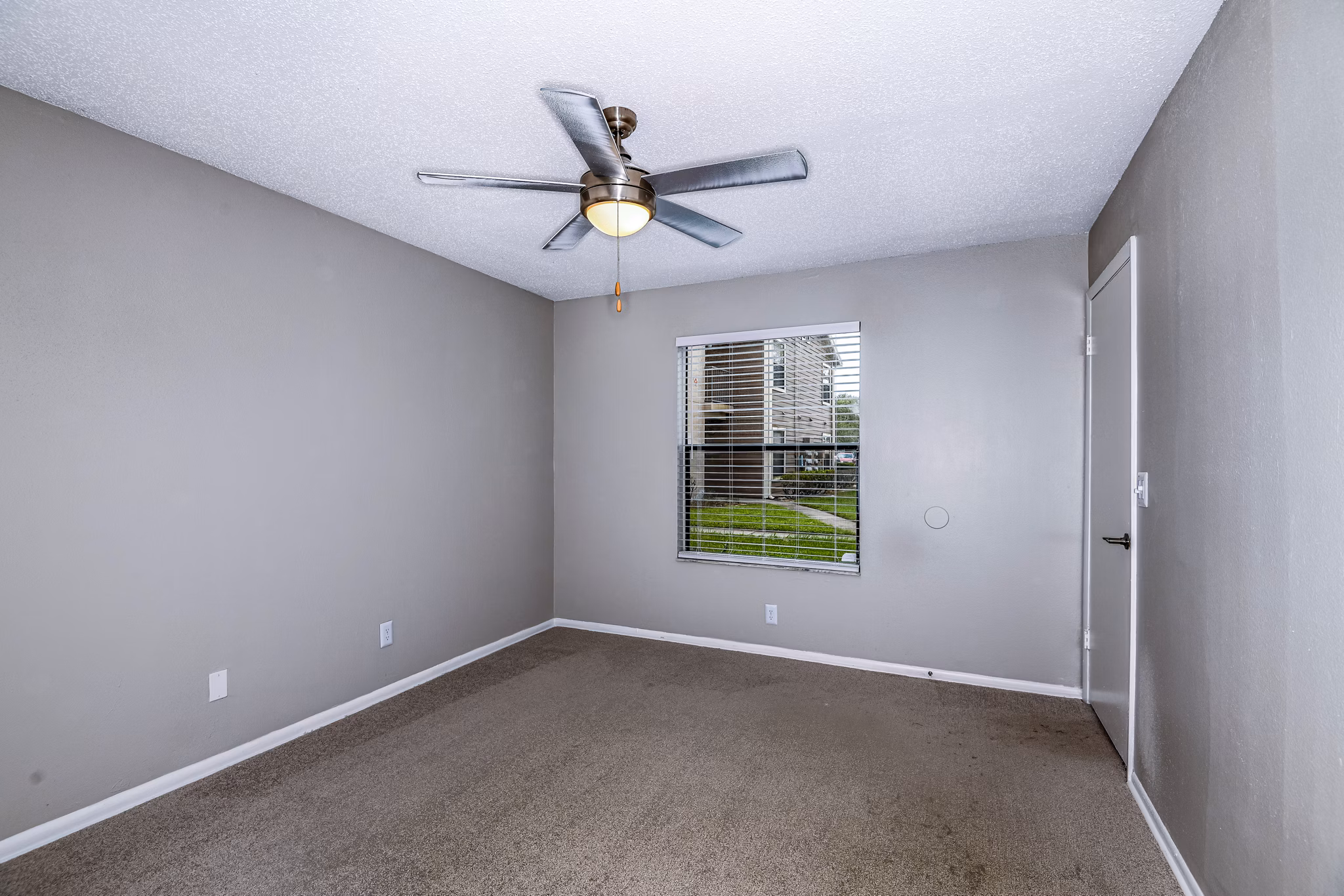 Cozy bedroom with natural light and modern dÃ©cor at Heron Lake Apartments