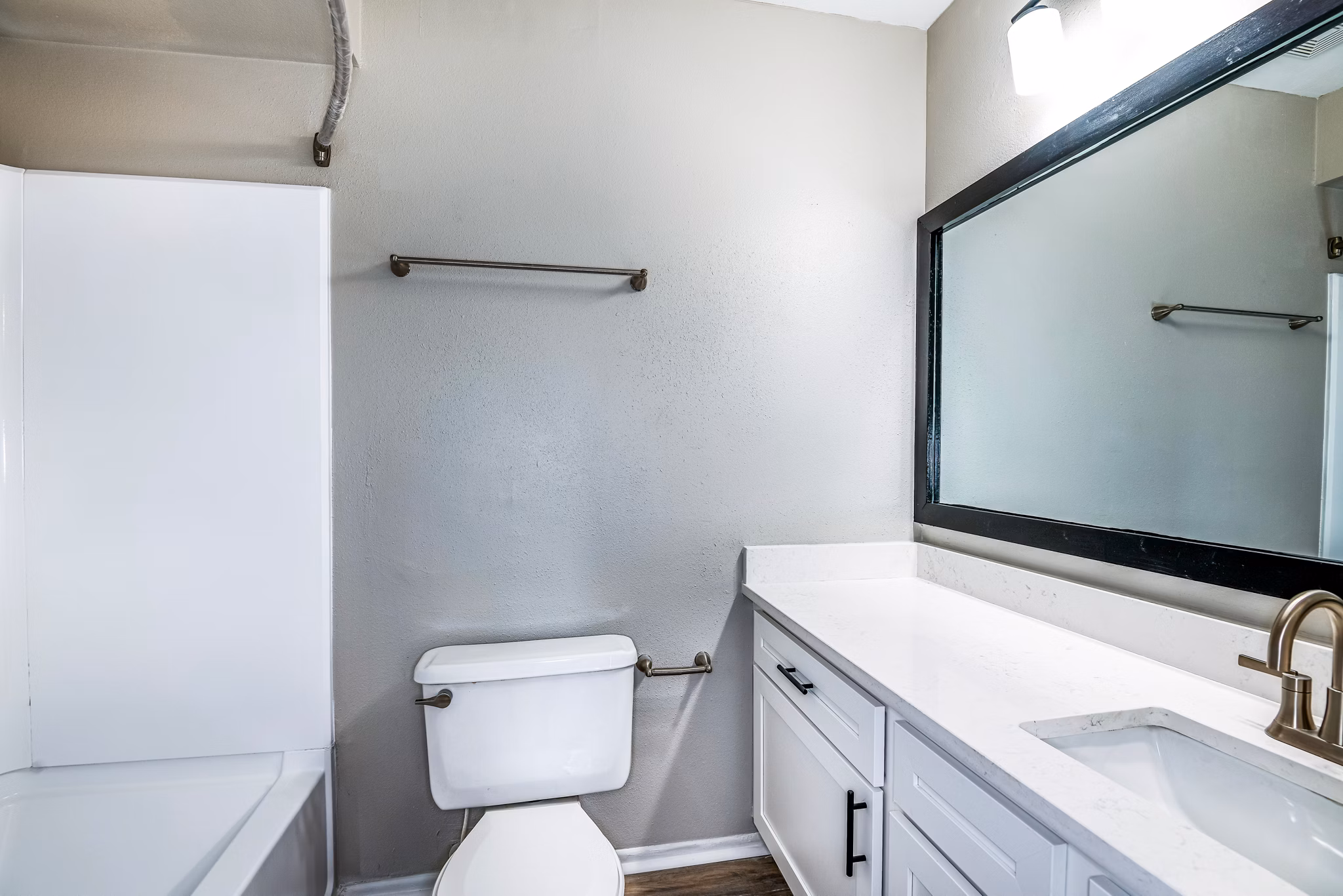 Spacious bathroom with modern fixtures at Heron Lake Apartments featuring luxury amenities for a comfortable living experience