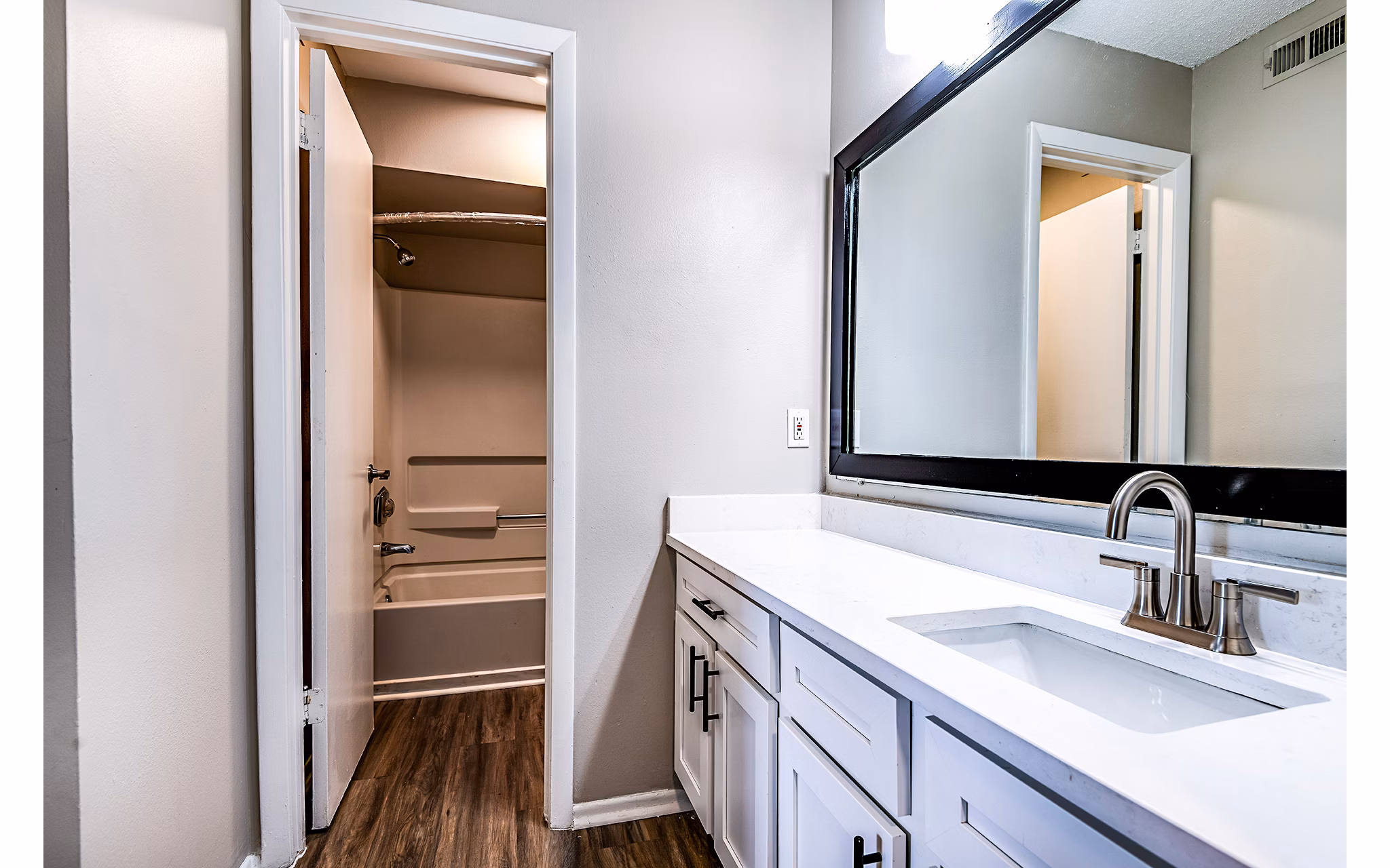 Elegant bathroom with modern fixtures at Heron Lake Apartments